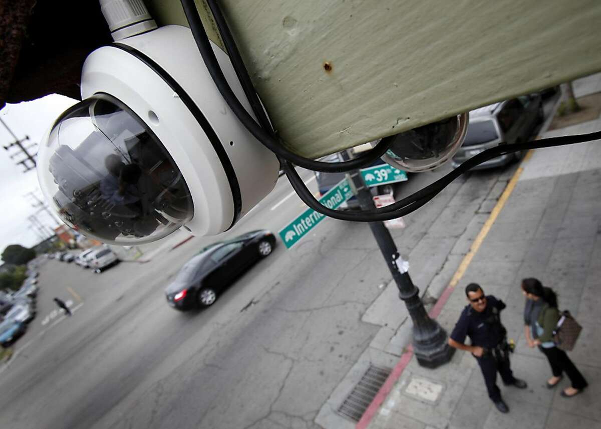 One of the installed cameras (left) can record quality facial features a half block away. Four months after the murder of Jesus Campos, Oakland, Calif. merchants are installing cameras along International Blvd. to help with investigations. Seventeen cameras are being installed between 42nd Avenue and Fruitvale Street.