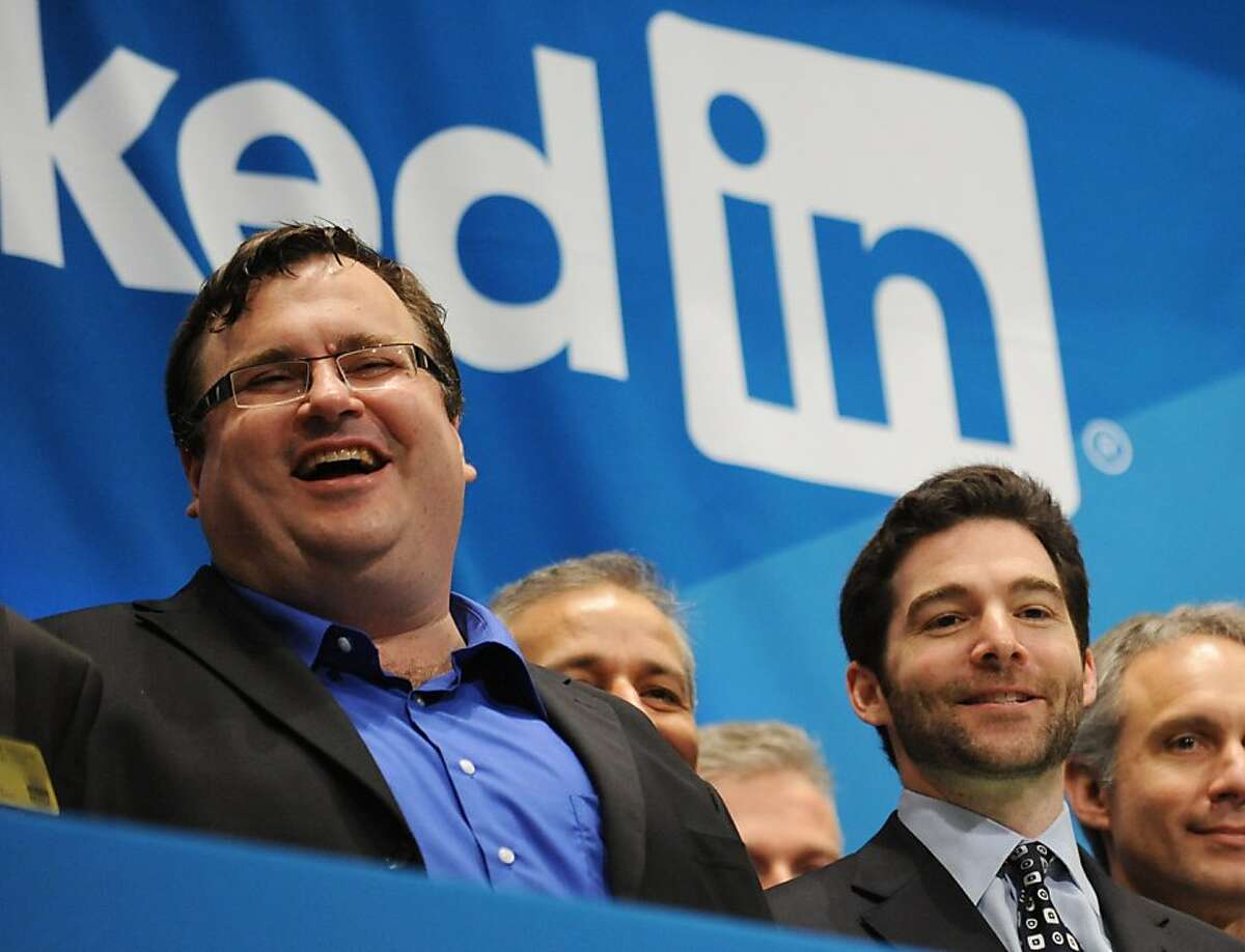 Linkedin founder Reid Garrett Hoffman (left) and CEO Jeff Weiner (right) just before ringing the opening bell of the New York Stock Exchange during the initial public offering of the company.