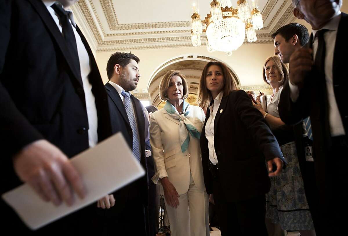 WASHINGTON - JULY 7: House Minority Leader Nancy Pelosi (D-CA) (3rd L) leaves after speaking with reporters on Capitol Hill July 7, 2011 in Washington, DC. Pelosi spoke to reporters about a meeting she attended with U.S. President Barack Obama and otherCongressional leaders about resolving the United State's debt crisis and the potential of the nation defaulting on its debt.
