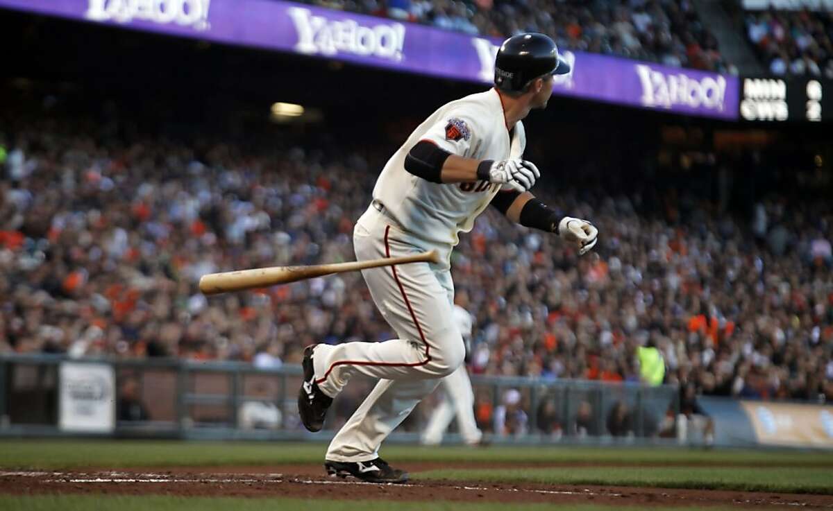 San Francisco Giants catcher Eli Whiteside (22) follows the flight of his solo home run in the bottom of the third inning against the San Diego Padres Thursday, July 7, 2011, in San Francisco, calif.