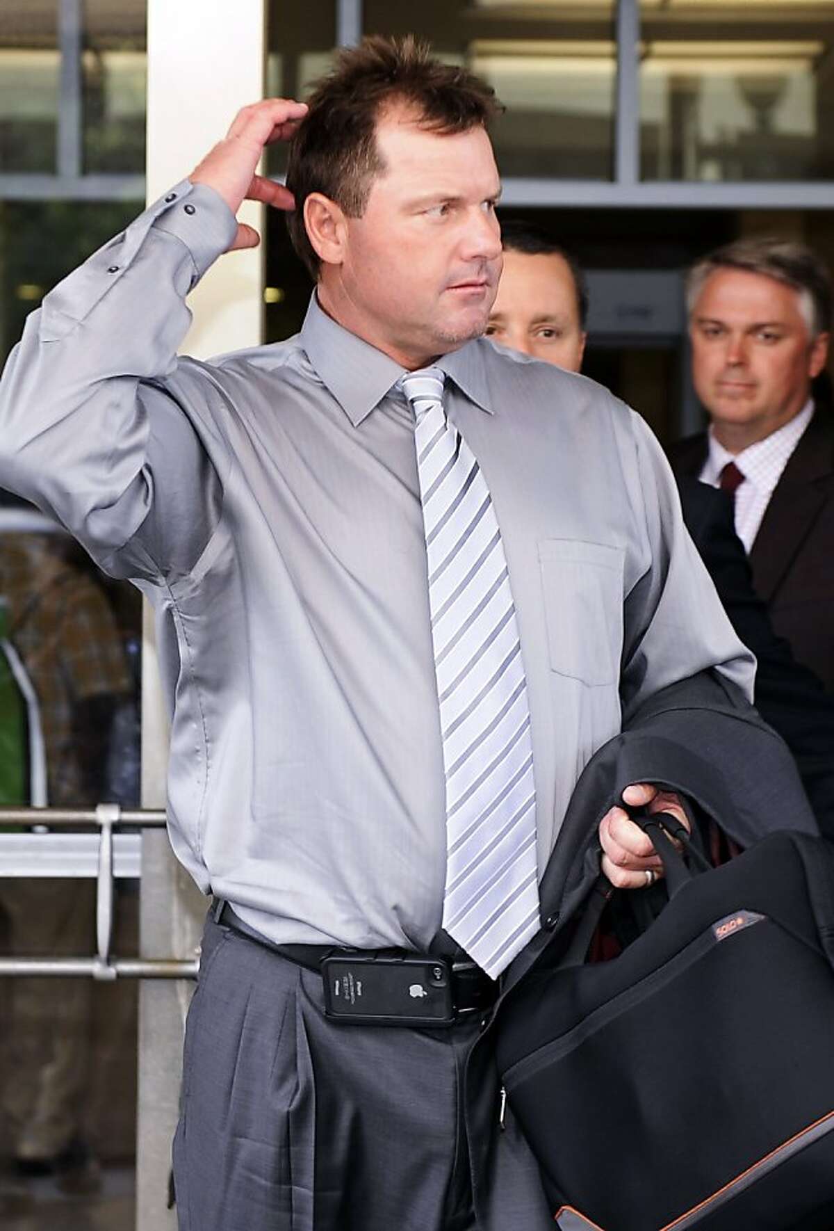 Former Major League Baseball pitcher Roger Clemens exits the federal court in Washington, Wednesday, July 6, 2011, where he is on trial on charges of lying to Congress in 2008 when he denied ever using performance-enhancing drugs during his 23-year career.