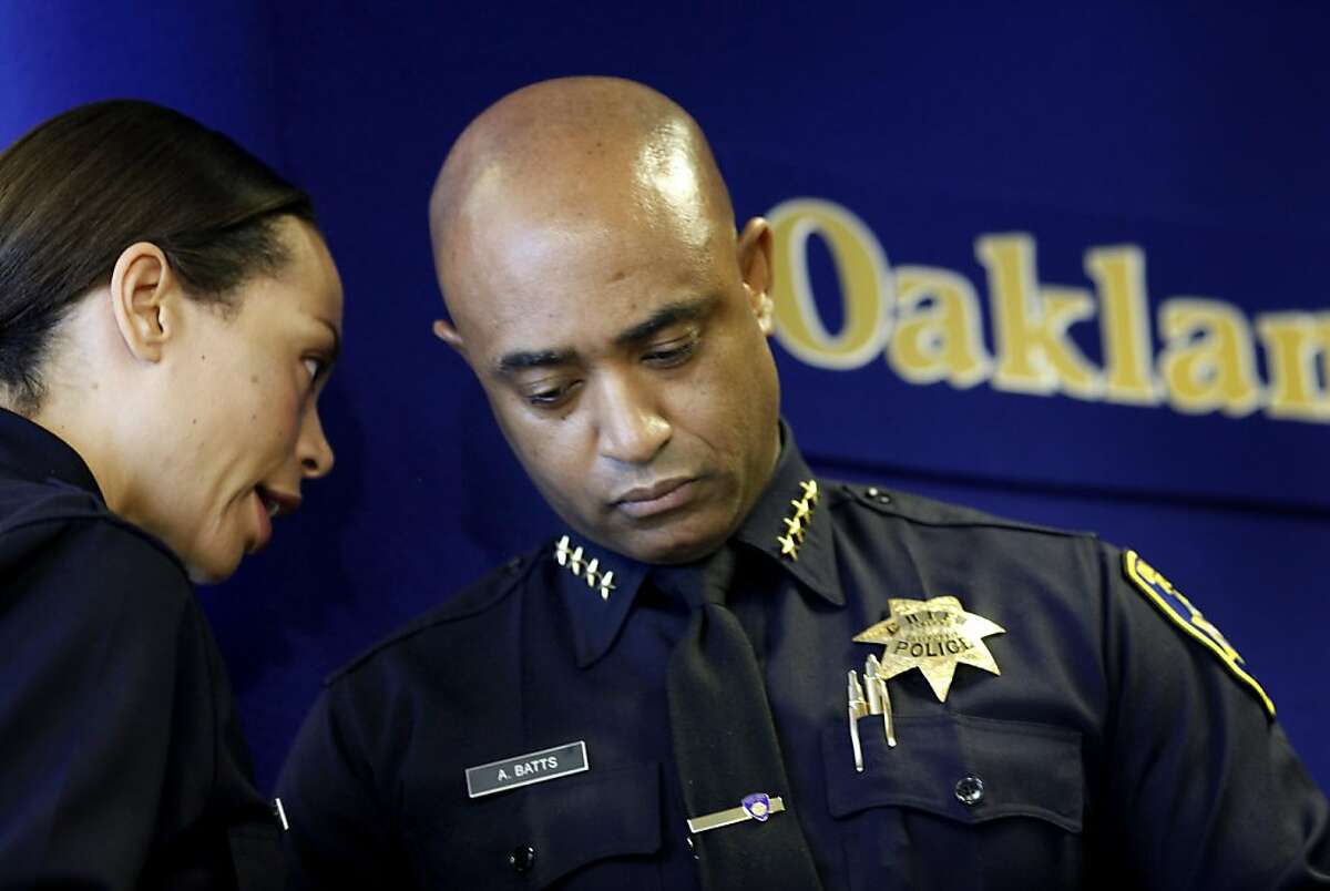 Police Chief Anthony Batts (right) listened to officer Holly Joshi during the press conference. Oakland Police Chief Anthony Batts announced a major reorganization of his department Wednesday July 6, 2011 that would involve making officers less specialized and more involved with the investigative process.