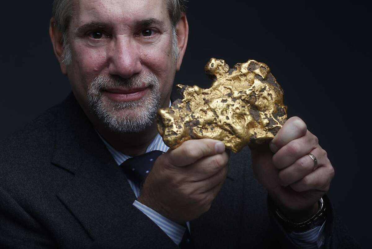 Don Kagin holds a 98.6 ounce gold nugget in the Chroniicle studio on Friday January 14, 2011 in San Francisco, Calif. He and his business partner Fred Holabird are auctioning off the nugget in Sacramento on Wednesday March 16, 2011.
