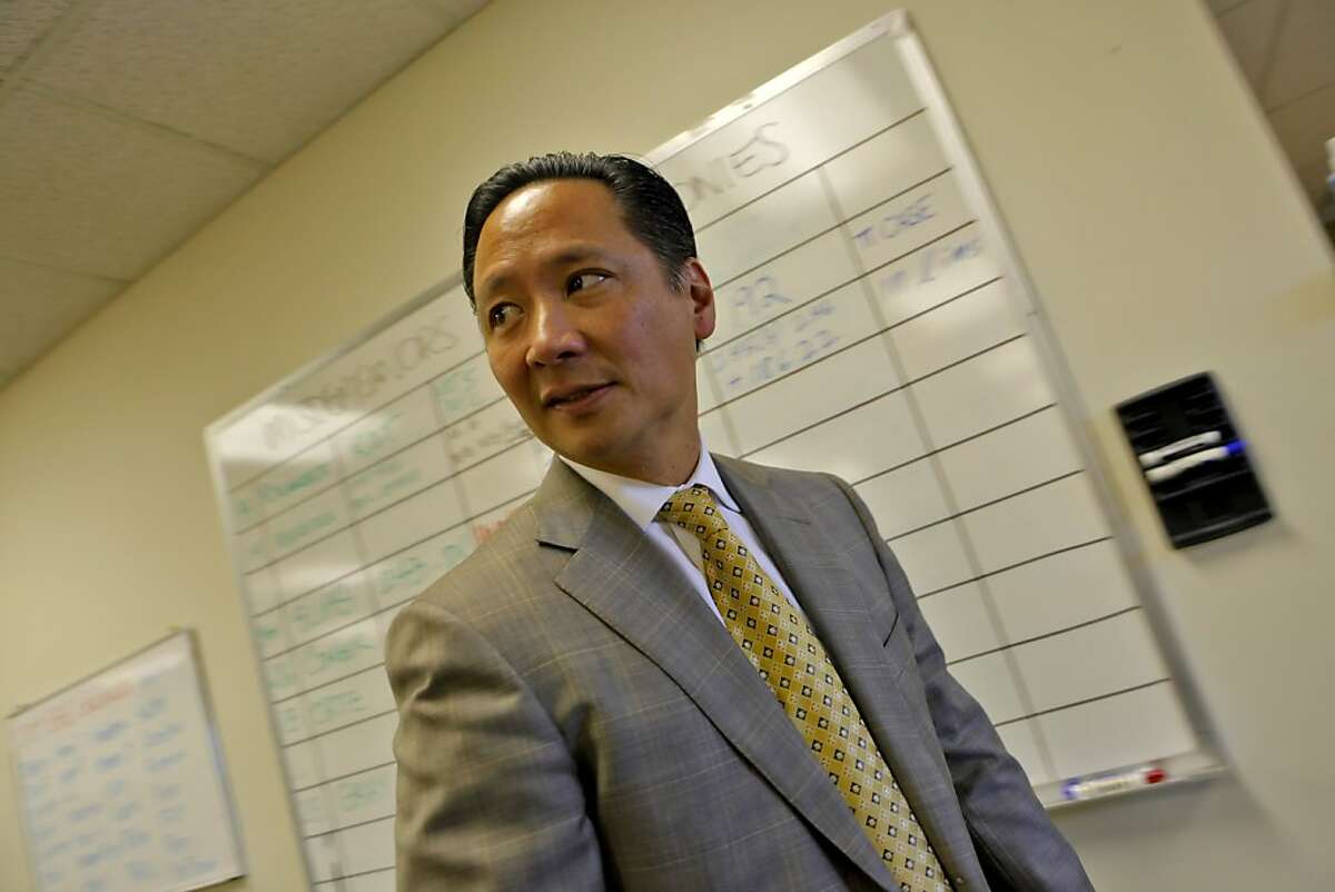San Francisco Public Defender Jeff Adachi walks through his office where the board of misdemeanors and felonies hangs for his staff, Tuesday Sept. 29, 2010, in San Francisco, Calif.