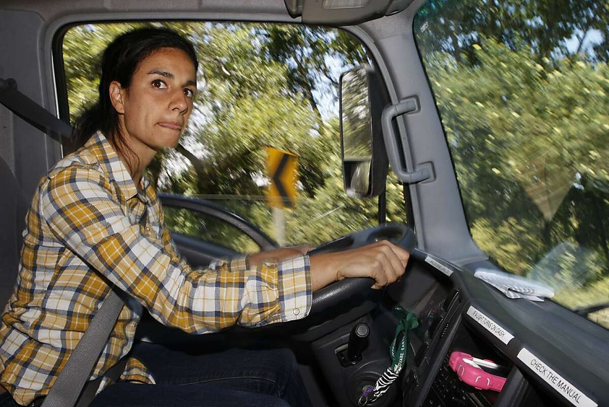 Adrianna Silva, co-owner of Tomatero Farm in Watsonville, Calif., heads out to the Haight Street farmer's market from home on Wednesday, June 22, 2011.