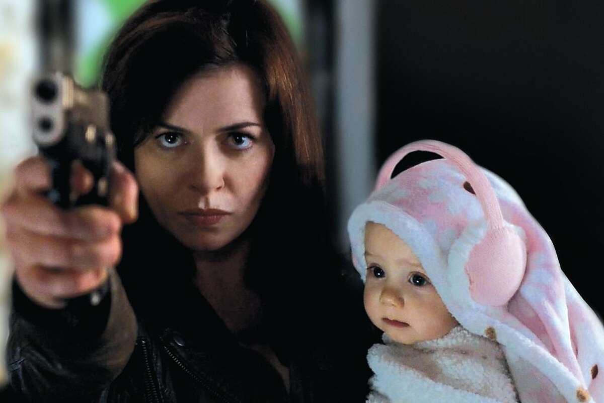Gwen Cooper (Eve Myles) protecting her daughter in the fourth season of "Torchwood."