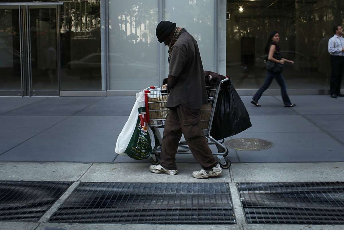 A homeless man walks down the street on June 20, 2011 in New York City. 