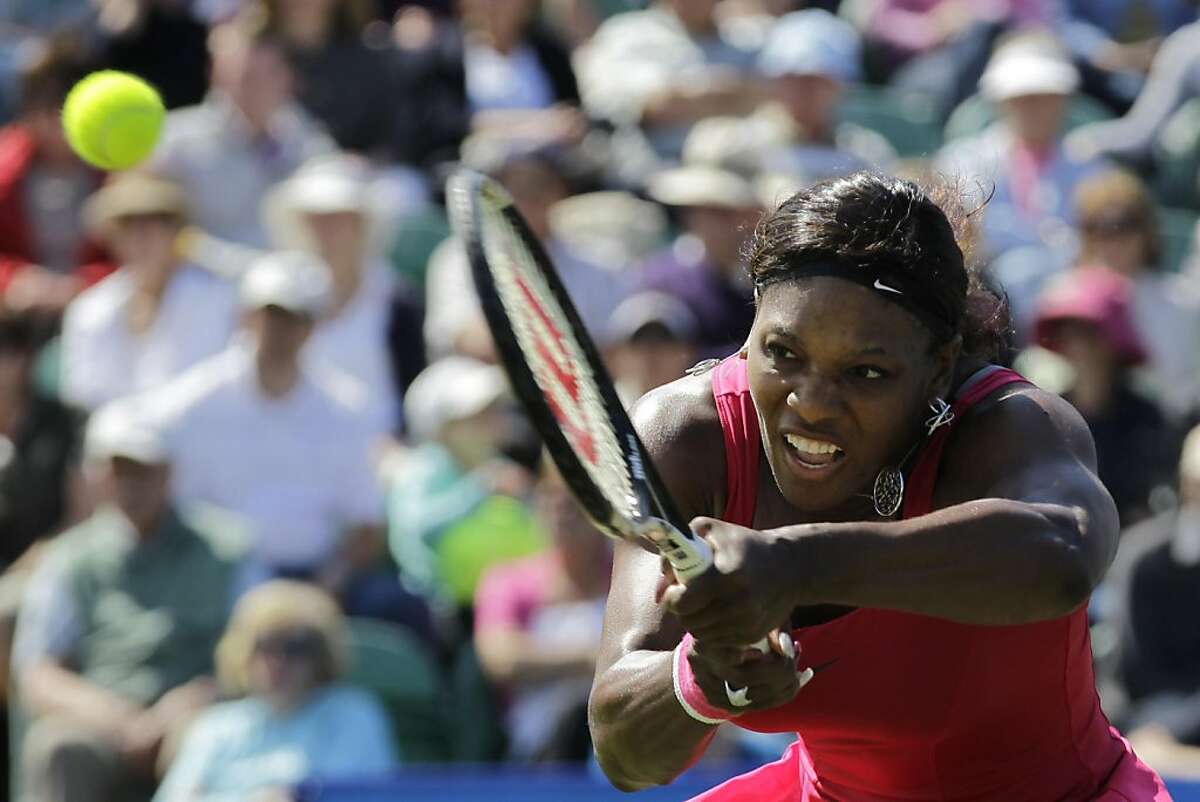 U.S.'s Serena Williams plays a return to Russia's Vera Zvonareva during their second round single tennis match at the Eastbourne International grass court tournament in Eastbourne, England, Wednesday, June 15, 2011. (AP Photo/Sang Tan)