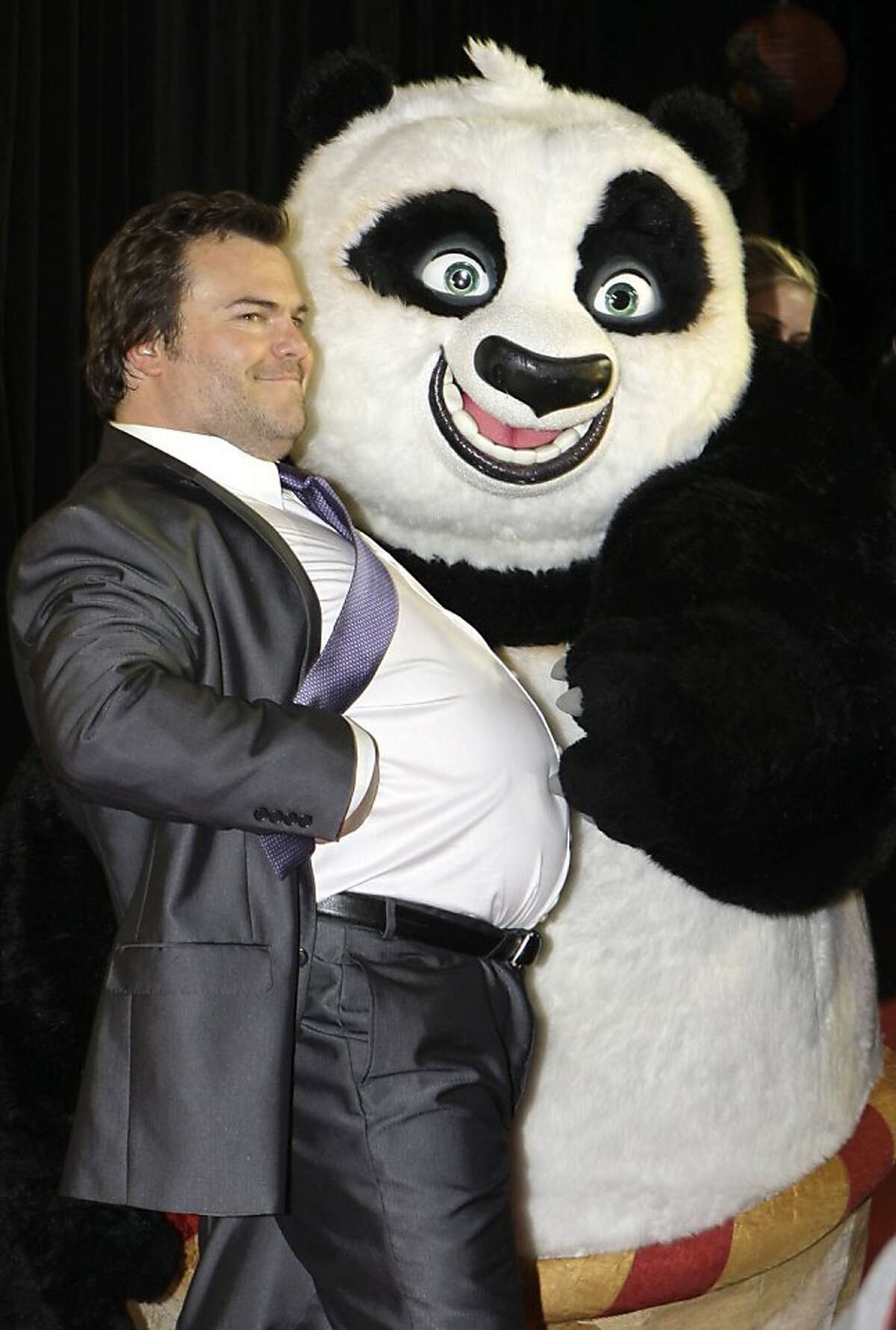 U.S. actor Jack Black poses with a panda character as he attends the Australian premiere of the movie Kung Fu Panda 2 in Sydney, Monday, June 13, 2011.