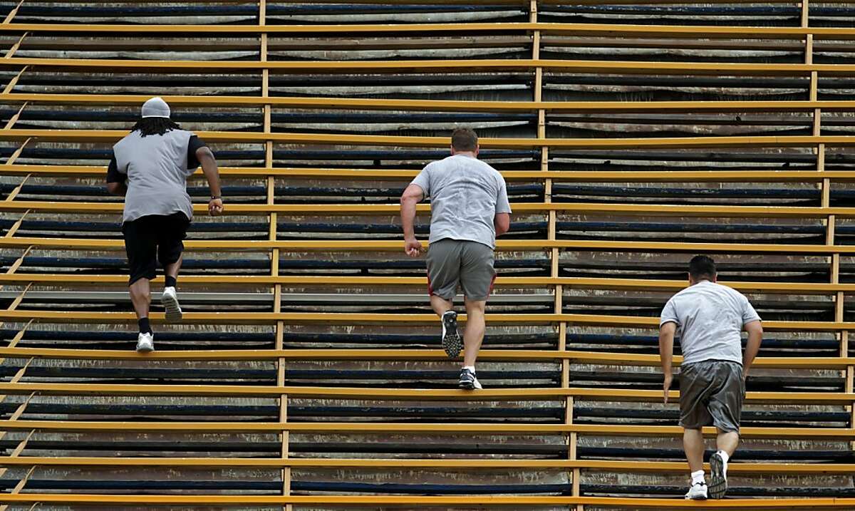 Defensive players sprint up the Spartan Stadium bleachers during a 49ers players' practice in San Jose, Calif. on Tuesday, June 28, 2011.