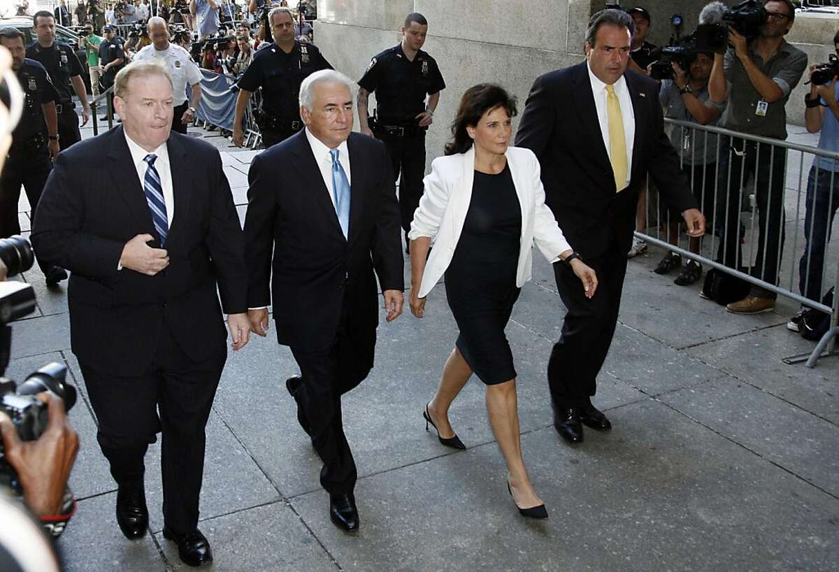 Former International Monetary Fund leader Dominique Strauss-Kahn arrives at New York Supreme court with his wife Anne Sinclair, Friday, July 1, 2011. Prosecutors have serious questions about the credibility of a hotel housekeeper who has accused Strauss-Kahn of sexual assault, and he is expected to have his strict bail conditions reduced Friday, according to people familiar with the case.