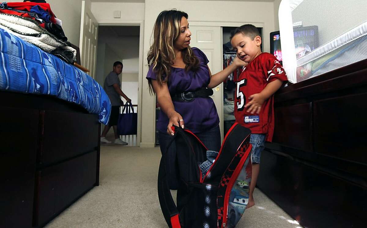 Alicia Alferez is raising her three sons Alexei Mendoza, 14 (rear), Jacob Fronco, 5 (not in photo) and Issaeih Fronco, 3, (right) on about $33,000 a year. Her kids are covered through Healthy Families program, a health program for kids from families slightly above Medi-Cal eligibility. Right now there are plans to raise copays for Healthy Families, but that may be held up temporarily. Wednesday, June 29, 2011