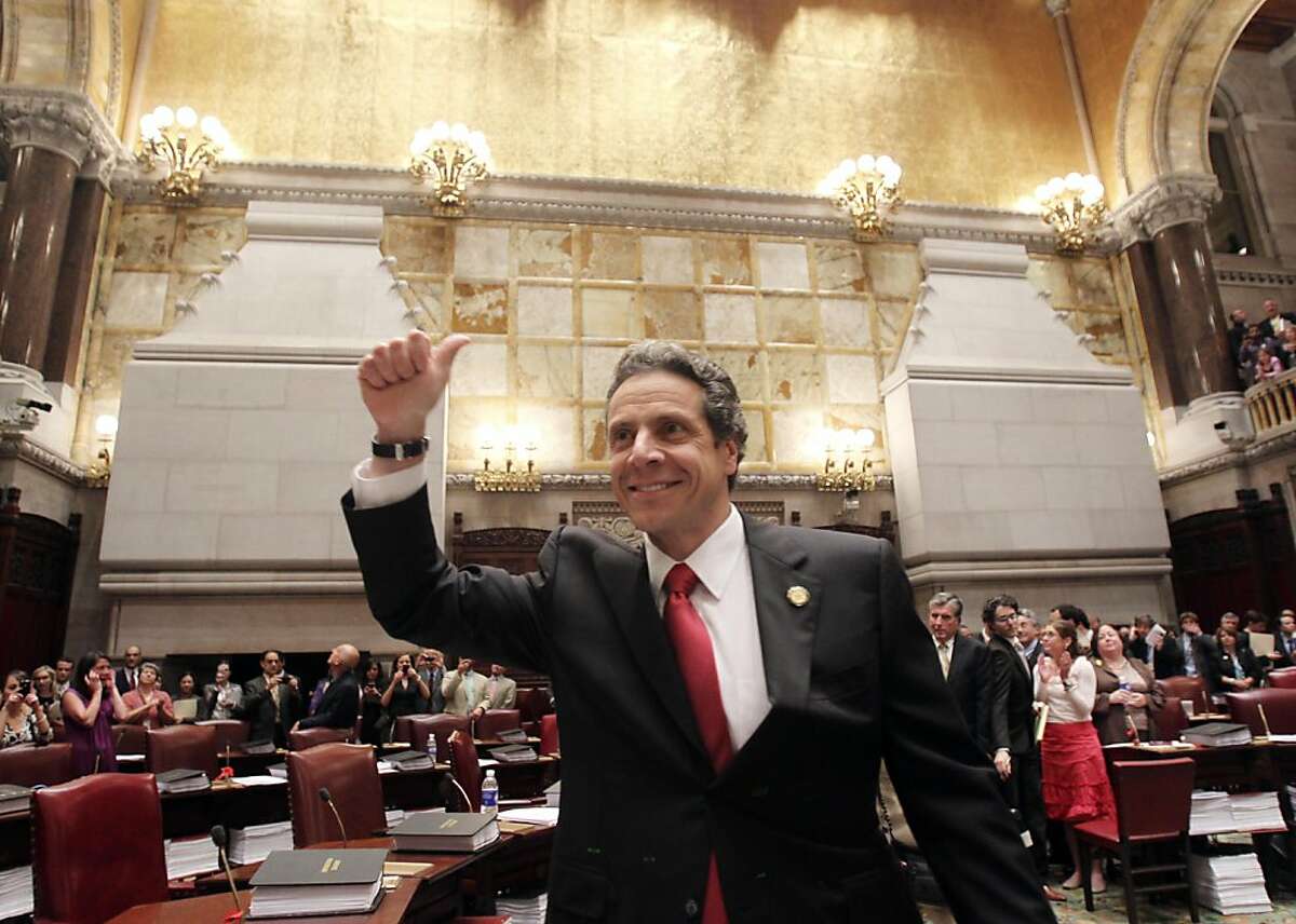 New York Gov. Andrew Cuomo reacts after same sex marriage was legalized after a vote in the Senate Chamber at the Capitol in Albany, N.Y., on Friday, June 24, 2011.