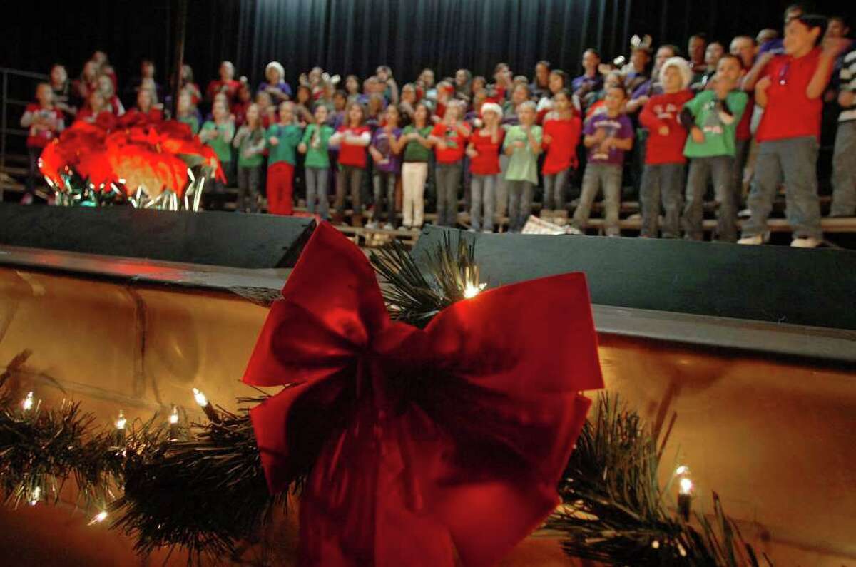 Groves Elementary's students sing in a Christmas program at the school on Monday. Some Southeast Texas schools are removing similar programs from holiday activities. Photo taken Tuesday, December 6, 2011 Guiseppe Barranco/The Enterprise