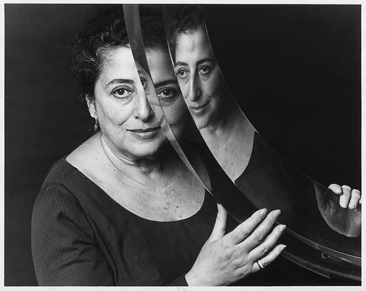 Frida Koblick and one of her works of transparent cast acrylic. Photo was taken in 1982.