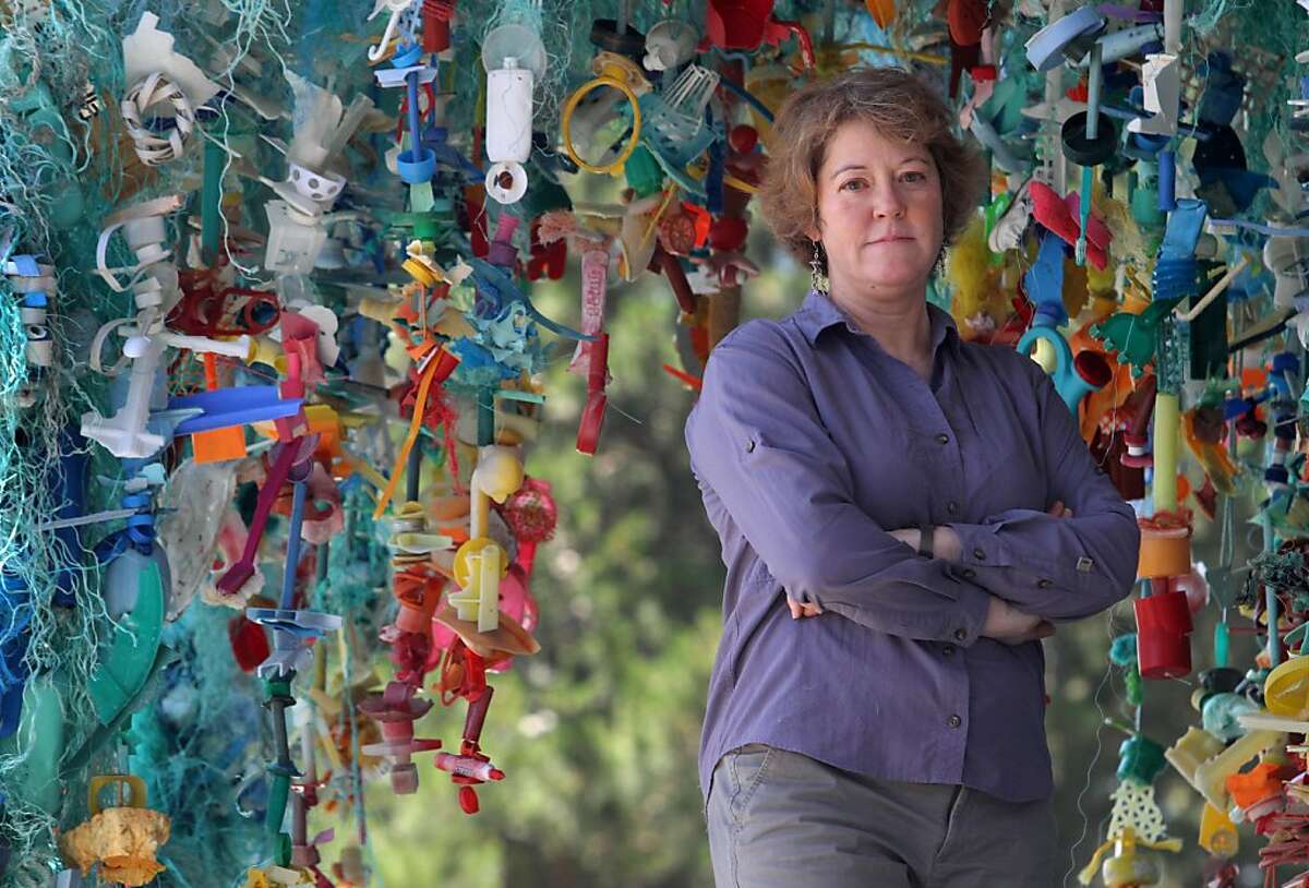 Artist Angela Haseltine Pozzi of Bandon, OR stands with her sculpture "Gyre" on Monday in Sausalito, Calif. at the Marine Mammal Center. The piece is part of the exhibition Washed Ashore: Plastics, Sea Life and Art which, will be on display June 25 through October 15.