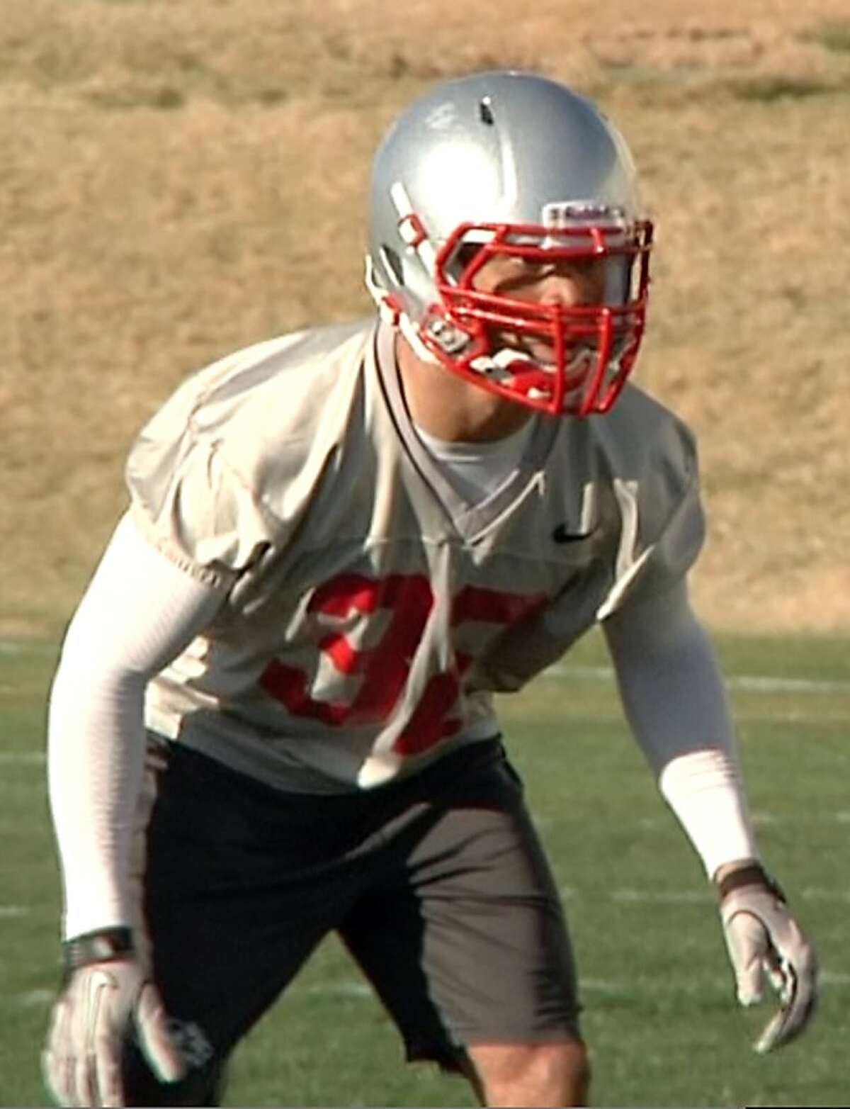 In an image taken from an April 2011 video, provided by the University of New Mexico, Deshon Marman takes part in football practice in Albuquerque, N.M. Marman’s saggy pants led to his arrest and removal from an airplane at San Francisco International Airport, authorities said Thursday, June 16, 2011.