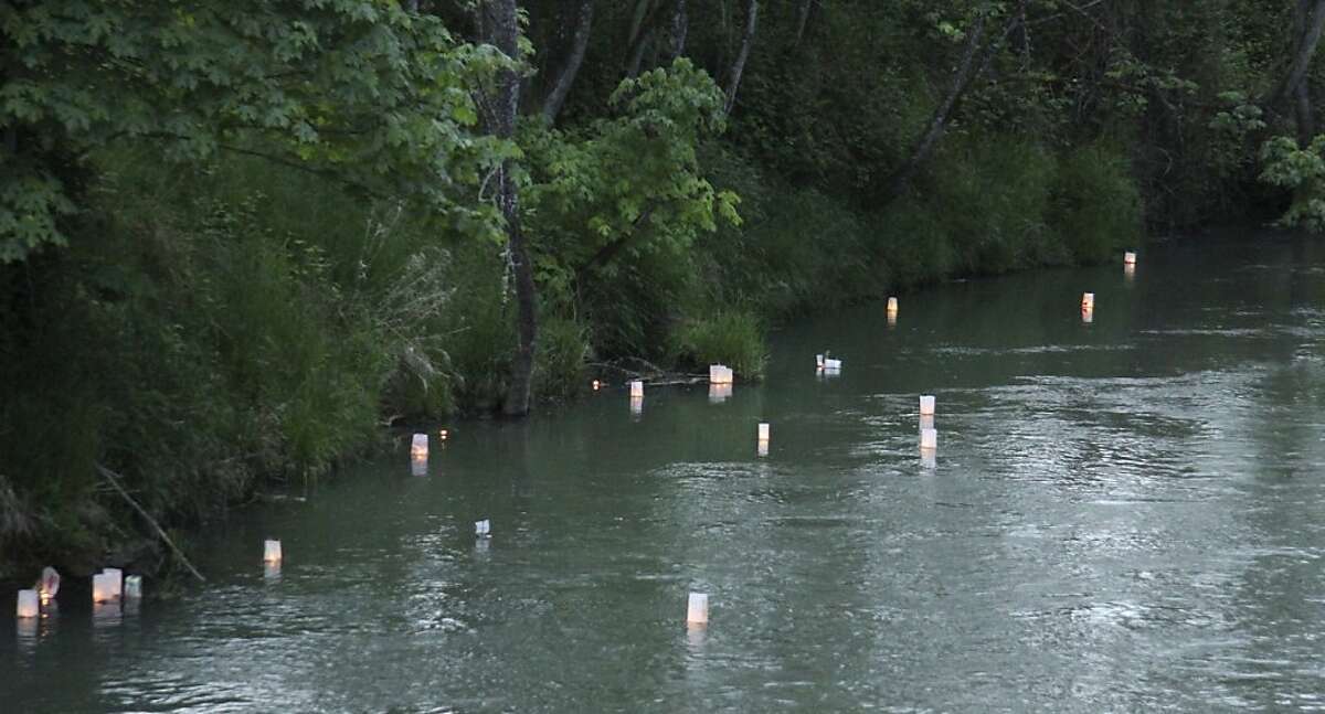 Tiny "prayer boats" with candles float on the Row River, where Josh Fattal used to swim sent by friends and colleagues of Fattal symbolizing the group's desire for the Fattal and Shane Bauer's freedom. Friends and colleagues of Josh Fattal gathered Saturday June 4, 2011 in Cottage Grove, Oregon to celebrate his 29th birthday _ and mark his second one in prison in Iran.