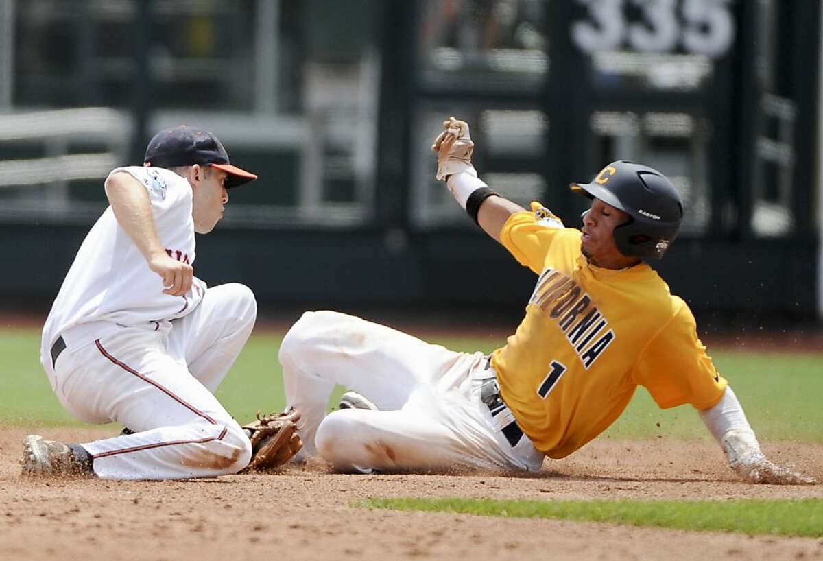 California's Austin Booker, right, is caught stealing second base by Virginia's second baseman Keith Werman, in the third inning of an NCAA College World Series baseball game in Omaha, Neb., Sunday, June 19, 2011.