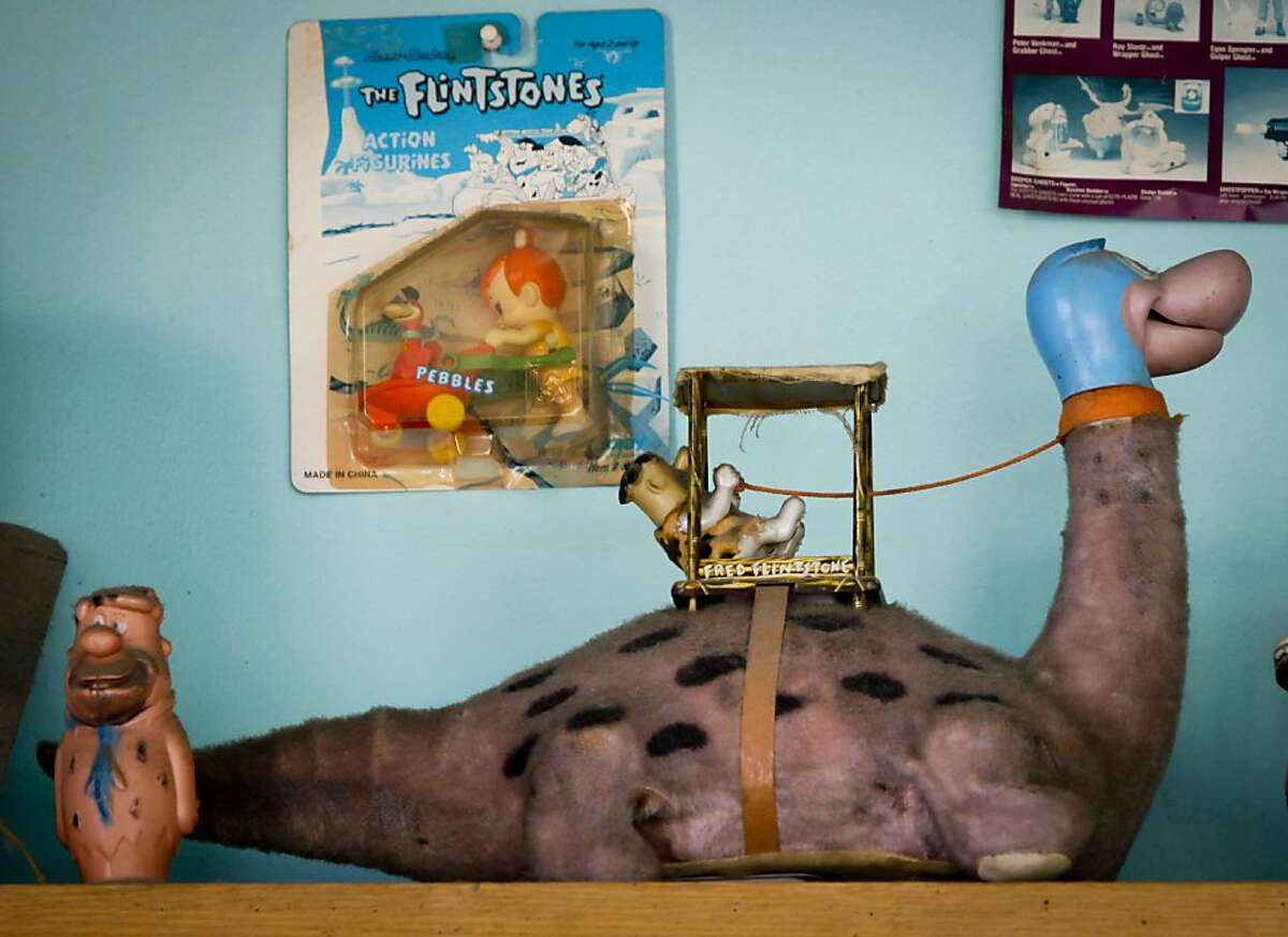 Fred Flintstone sitting on a dinosaur, seen on Wednesday, June 8, 2011 in San Francisco, Calif., is one of Jesse Fink's favorite toys on display in his ice cream/toy shop, Toy Boat.
