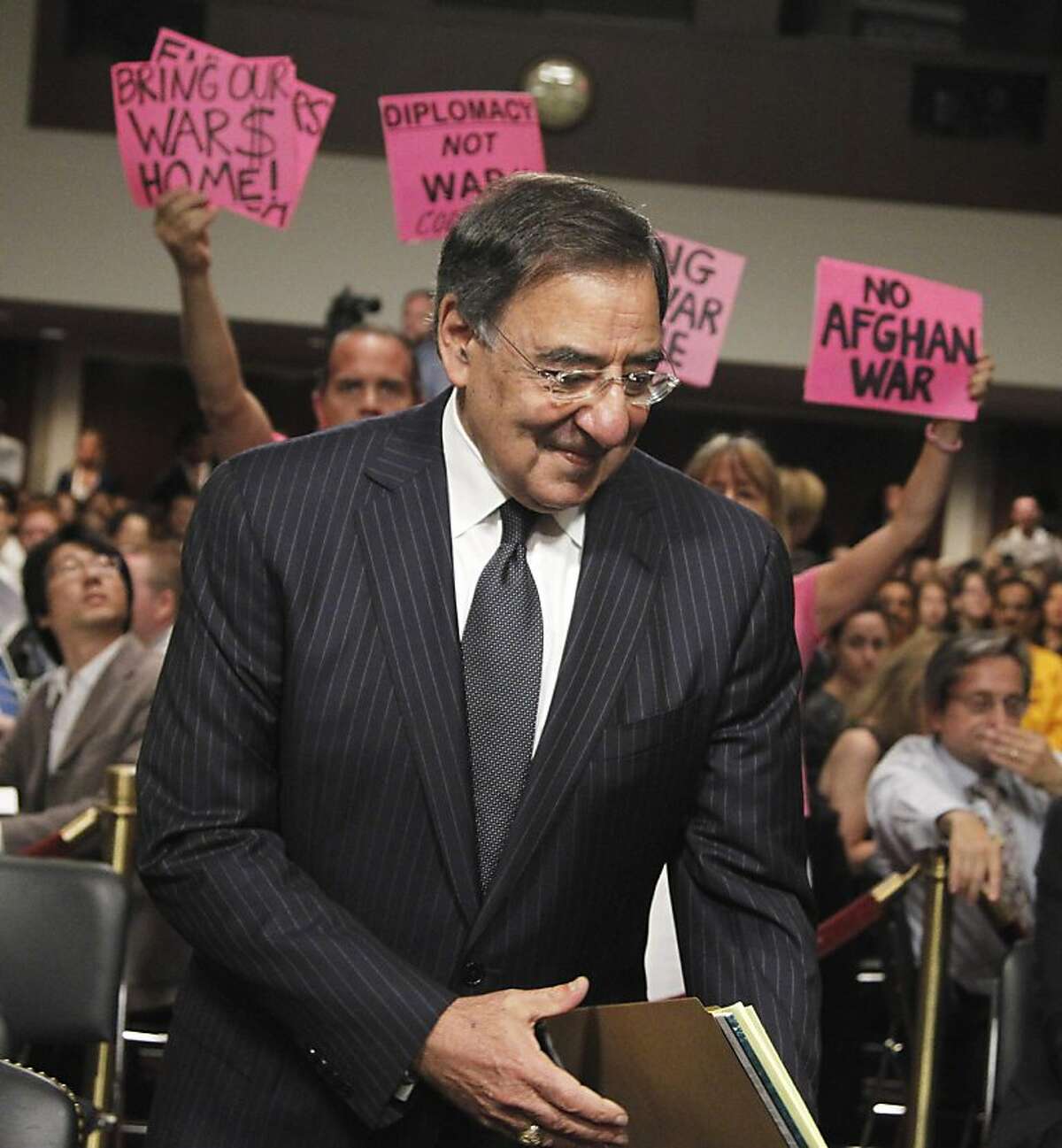 CodePink demonstrators greet Defense Secretary nominee, CIA Director Leon Panetta, as he arrives on Capitol Hill in Washington, Thursday, June 9, 2011, to testify before the Senate Armed Service Committee hearing on his nomination.