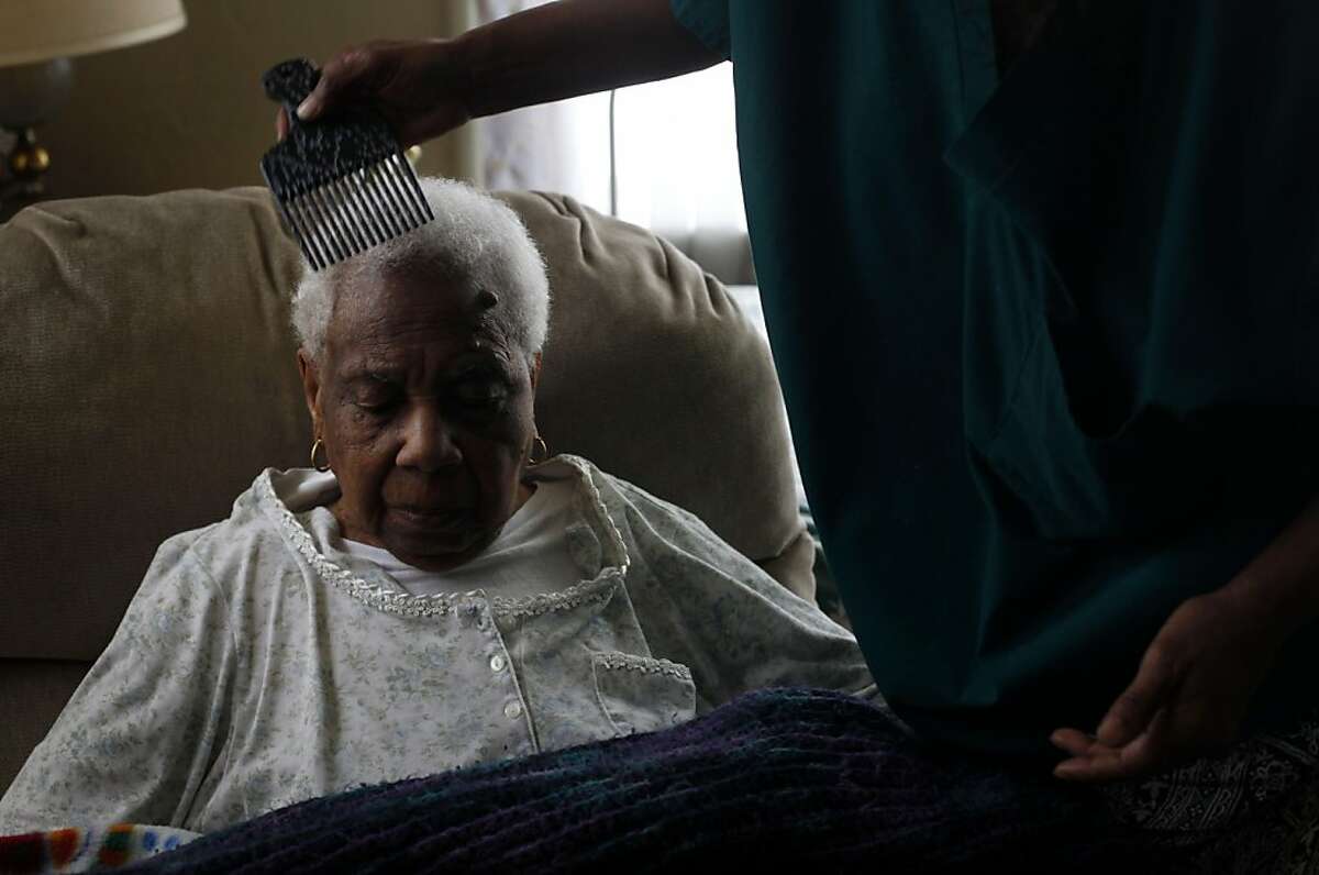 Two days before her 100th birthday, sitting her Berkeley home, Civil rights activist and former Berkeley city councilwoman Maudelle Shirek has her hair done by her niece Deborah Brown on Thursday June 17, 2011 in Berkeley, Calif.