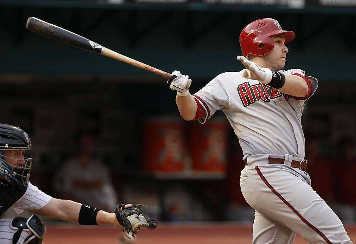 Arizona Diamondbacks' Miguel Montero follows through on a three-run RBI double in the first inning during a baseball game against the Florida Marlins in Miami, Monday, June 13, 2011.