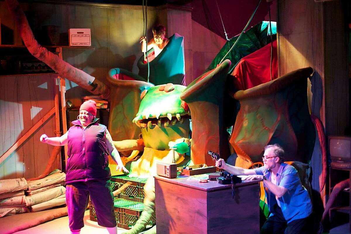 Audrey, the killer plant, prepares to claim another victim in Boxcar's "Little Shop of Horrors"
