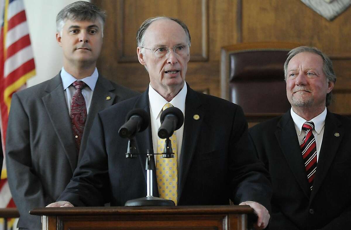 Alabama Gov. Robert Bentley sAlabama Gov. Robert Bentley is flanked by Sen. Scott Beason, R-Gardendale, left, and Micky Hammon, R-Decatur, right, as he speaks before signing into law what critics and supporters are calling the strongest bill in the nationcracking down on illegal immigration, on Thursday June 9, 2011 at the state Capitol in Montgomery, Ala. The bill allows police to arrest anyone suspected of being an illegal immigrant if they're stopped for any other reason. It also requires public schools to determine students' immigration status and makes it a crime to knowingly give an illegal immigrant a ride.