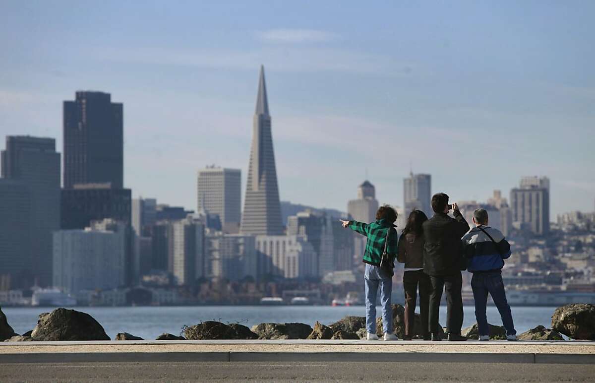 Sightseers take in the view of San Francisco from Treasure Island, Calif. on Thursday December 24, 2009.