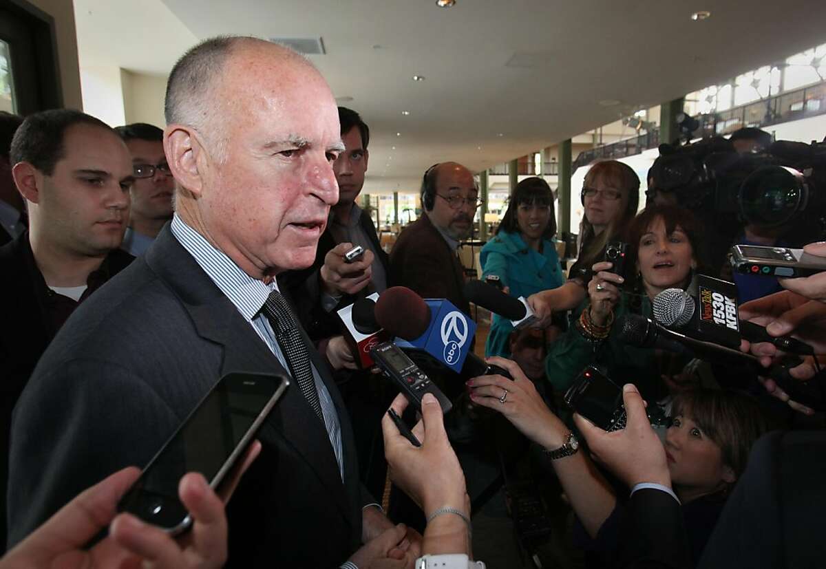 Gov. Jerry Brown talks with reporters before speaking before the California State Association of Counties Legislative conference in Sacramento, Calif., Wednesday, June 1, 2011. Brown called on county leaders to work together to help solve the state's budget problems