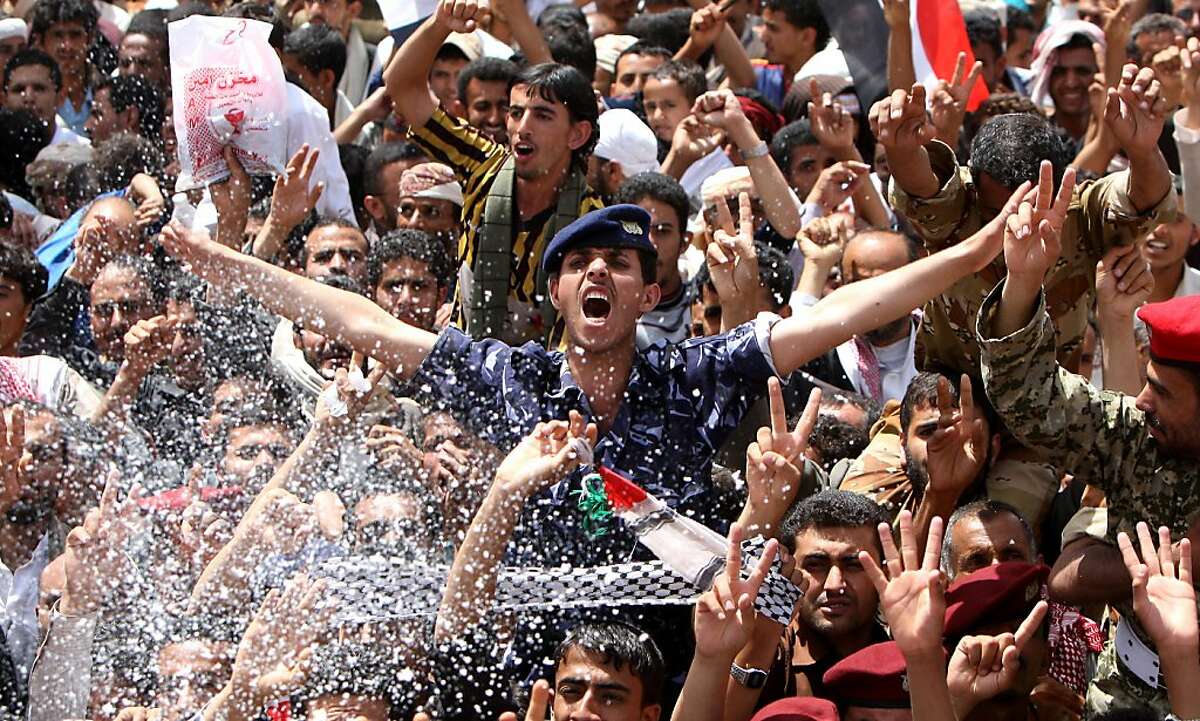 Yemeni anti-government protesters gather in Sanaa on June 5, 2011 to celebrate what they said was the fall of Yemen's regime after embattled President Ali Abdullah Saleh, wounded in a blast, left the country for medical treatment in Saudi Arabia.