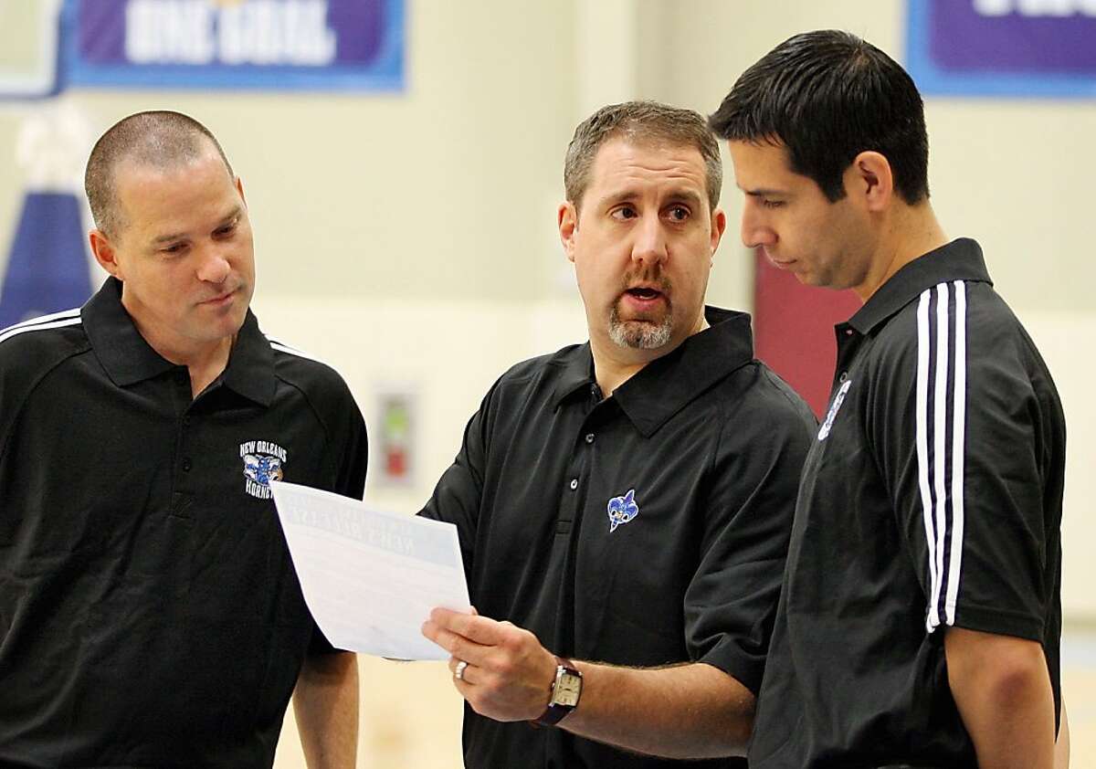 New Orleans Hornets three new assistant coaches, Mike Malone, left, Bryan Gates and James Borrego talk before a news conference. (AP Photo/The Times-Picayune, Eliot Kamenitz)