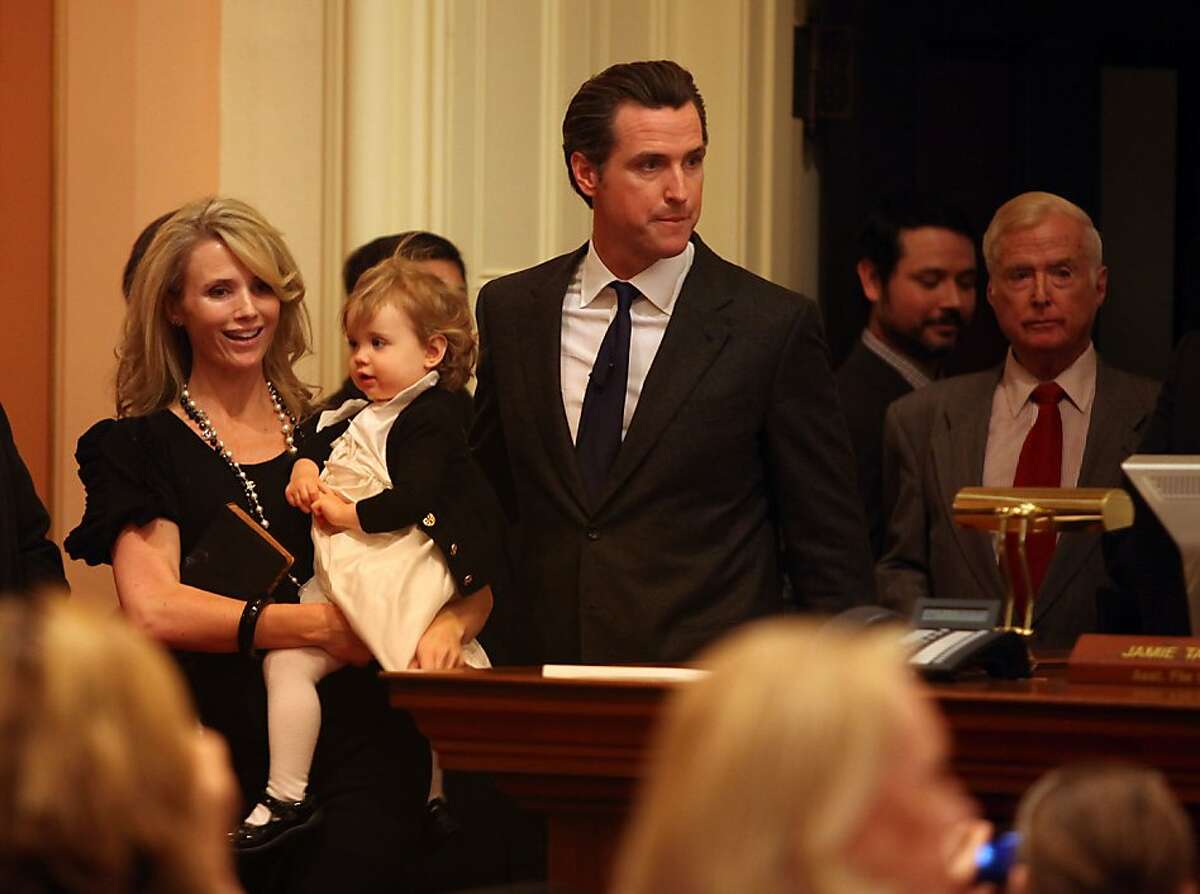 Mayor Gavin Newsom arrives with his wife Jennifer Siebel and daughter to get sworn in as lieutenant governor by his father, Hon. Judge William Newsom (far right) at the state capitol in Sacramento, Calif., on Monday, January 10, 2011.