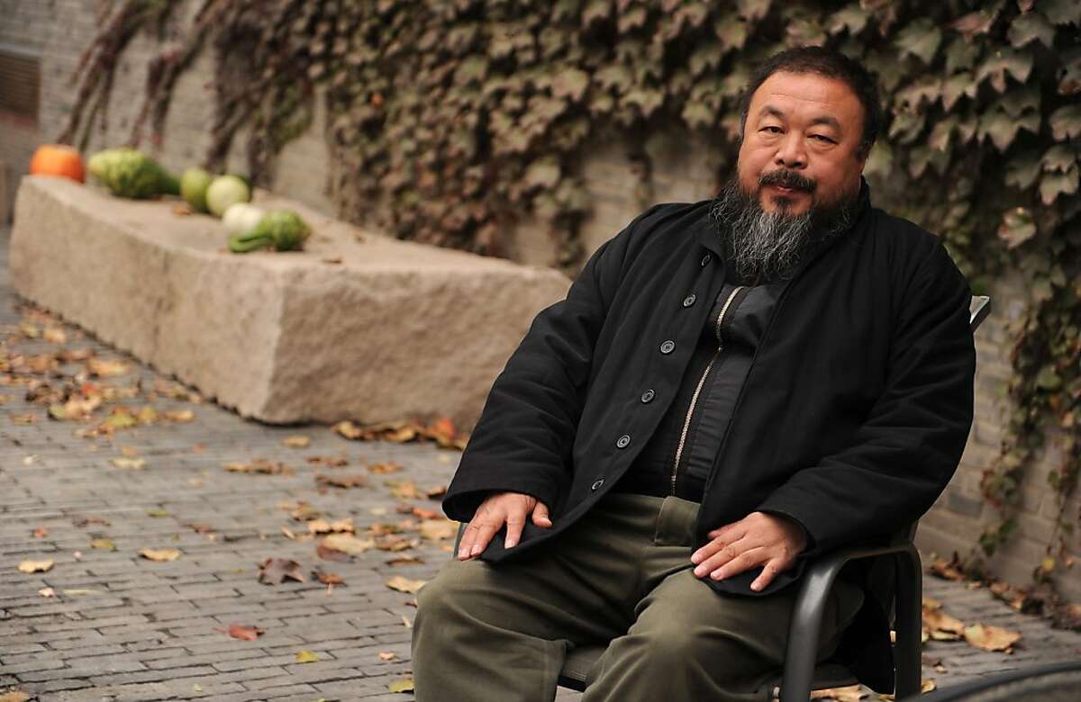 TO GO WITH AFP STORY by Shaun Tandon, US-China-rights-art-museum (FILES) Chinese artist Ai Weiwei sits in the courtyard of his home in Beijing where he remains under house arrest in this November 7, 2010 file photo. US museums are facing delicate choicesas they strive to meet a growing interest in China, cooperating with counterparts across the Pacific despite alarm over the detention of top artist Ai Weiwei.