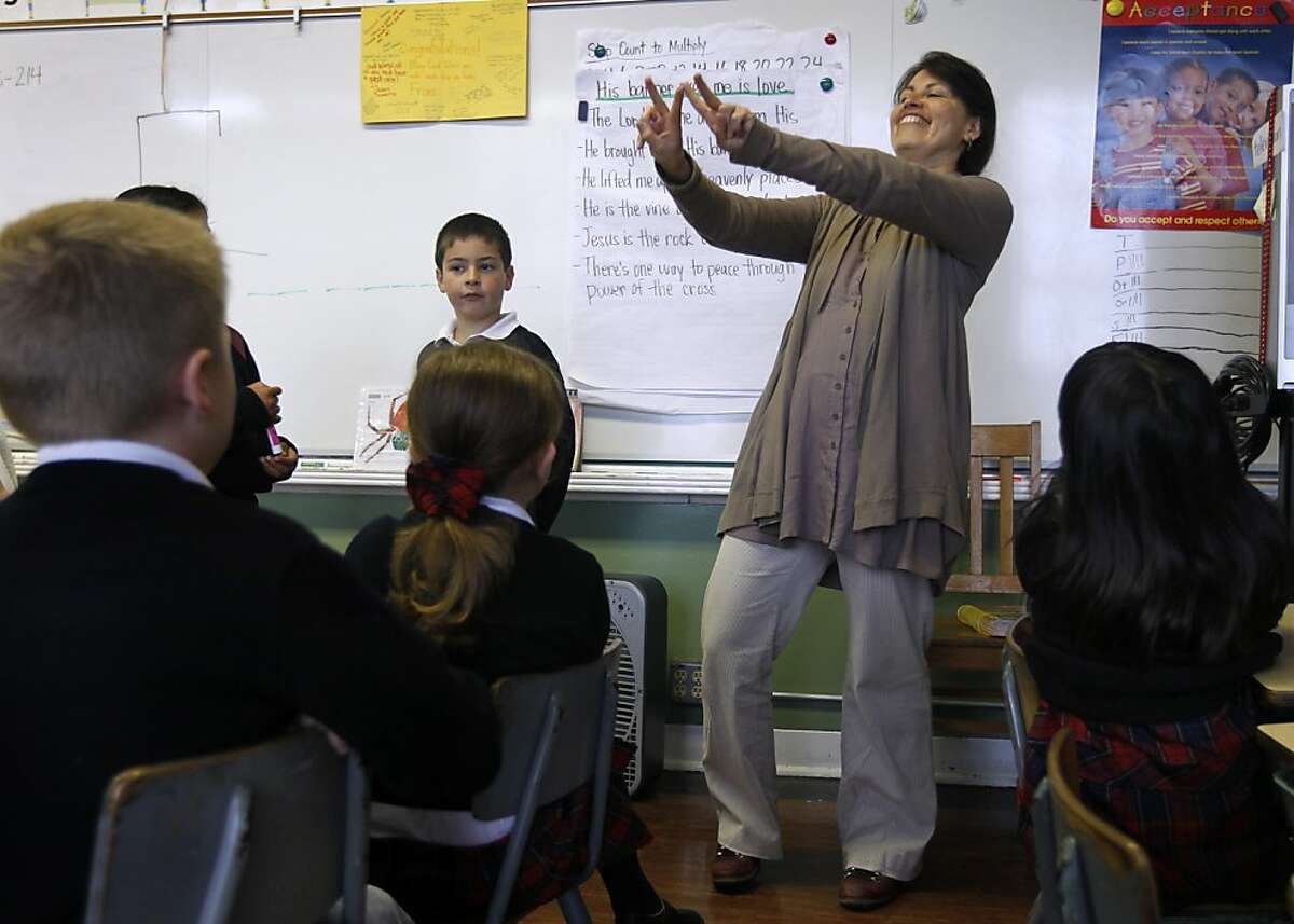 Claudia Portillo teaches the alphabet in Spanish to second graders at the Saint Philip School in San Francisco, Calif. on Tuesday, May 17, 2011. With foreign language programs being cut at the high school level, more and more language classes are being offered in elementary schools.