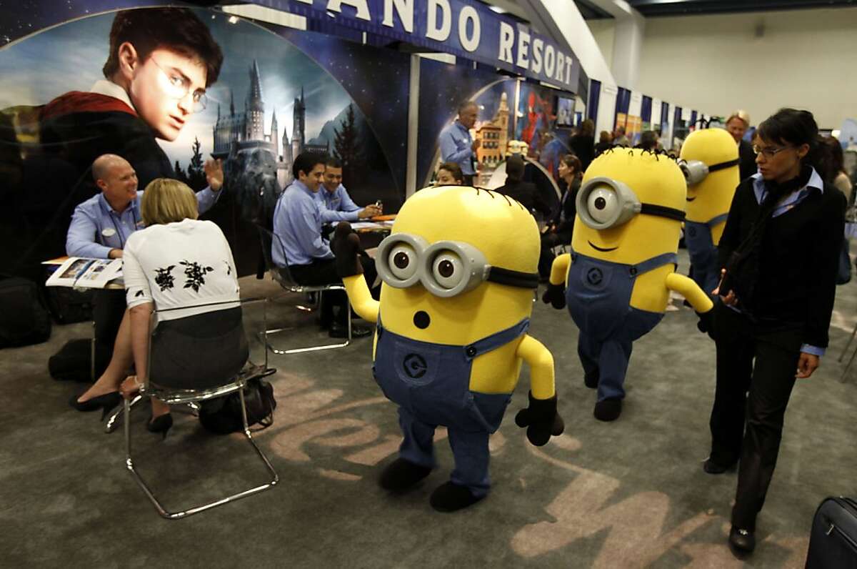 Minions from Universal Orlando Resort walk the convention floor. Travel companies from around the world have converged for a one week long convention at Moscone Center in San Francisco Tuesday May 24, 2011. Since San Francisco is the host city, they have pulled out all the stops to attract the vibrant tourism trade to the Bay Area.