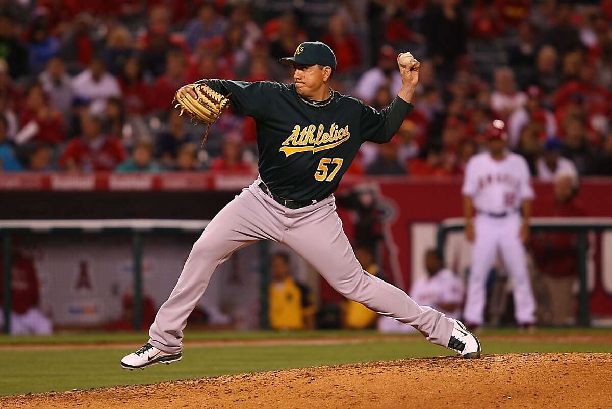 ANAHEIM, CA - MAY 23: Brian Fuentes #57 of the Oakland Athletics pitches against the Los Angeles Angeles of Anaheim in the eighth inning at Angel Stadium on May 23, 2011 in Anaheim, California.