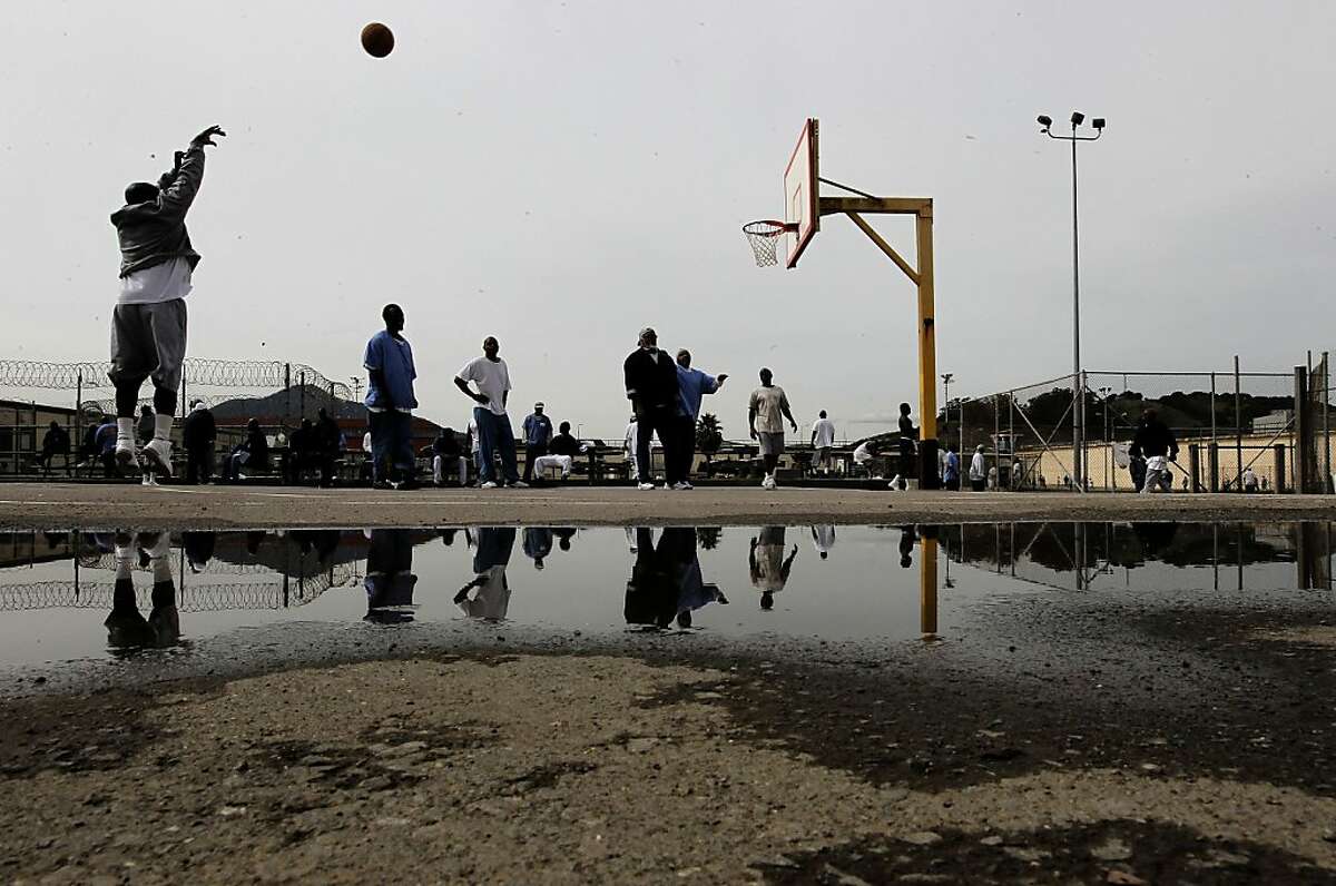 Prisoners shooting hoops in the exercise yard inside San Quentin State Prison, on Friday Mar. 4, 2011, in San Quentin, Ca. California State prison guards and their supervisors, have racked up an astounding 33 million hours of vacation, sick and other paid time off, which could amount to as much as a $1 billion liability for the state. A Senate report, a year ago, warned that mandatory furloughs at a 24-7 agency, would lead to such future burdens.