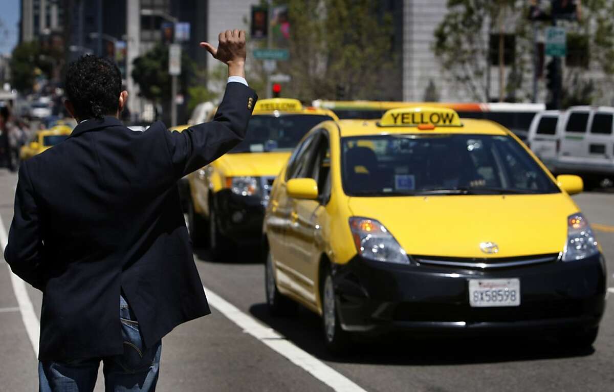 Taxi driver Alok Dutt urges fellow cabbies to honk their horns in front of City Hall in San Francisco, Calif. on Tuesday, May 3, 2011, to protest against a five percent surcharge for customers paying by credit cards.