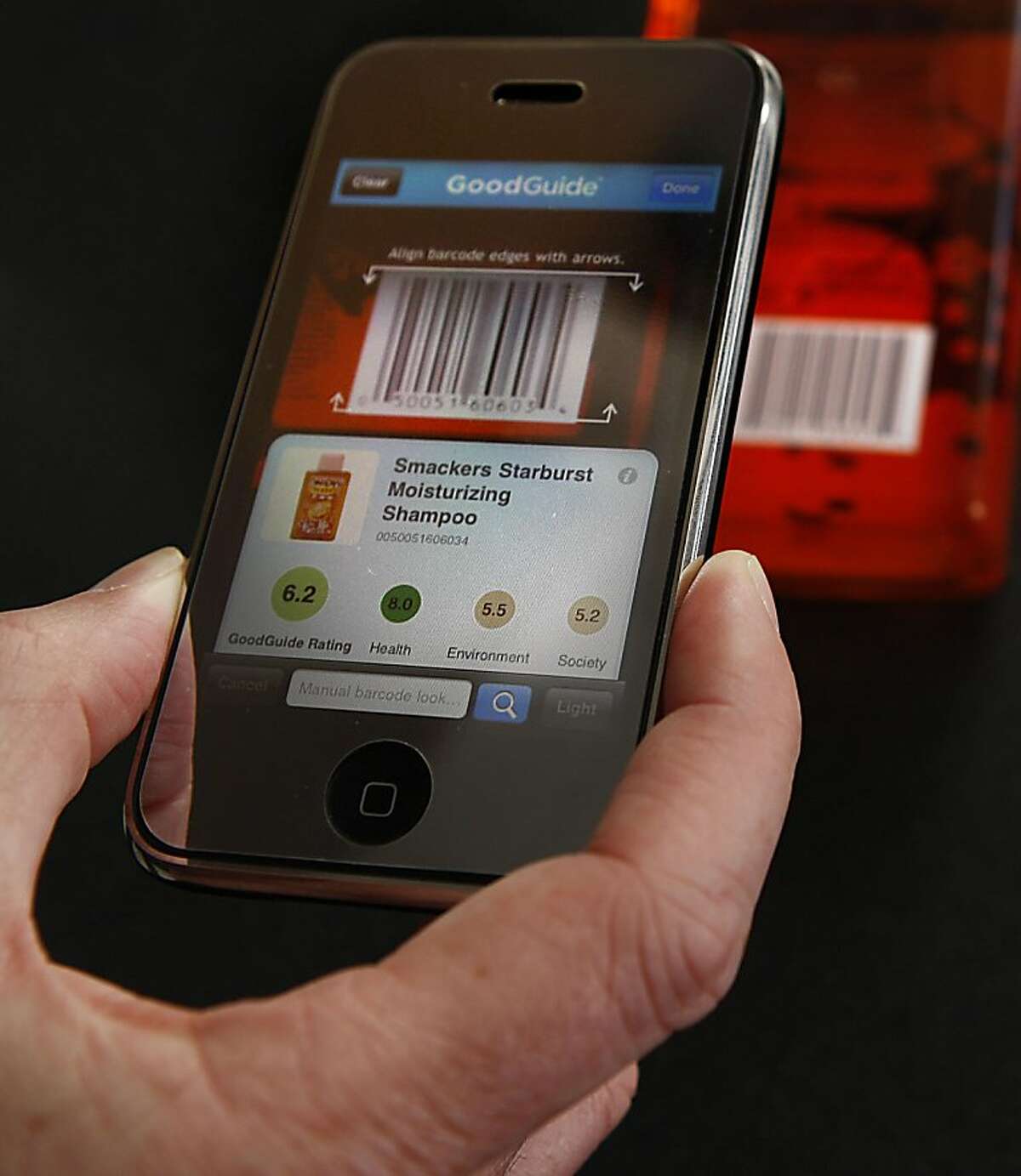 Founder Dara O'Rourke of GoodGuide, a resource for consumers looking to buy safe, environmentally good products showing how to scan a barcode at his office in San Francisco, Calif., on Tuesday, May 10, 2011. GoodGuide's iPhone app scans barcodes and looks up the product in its database.