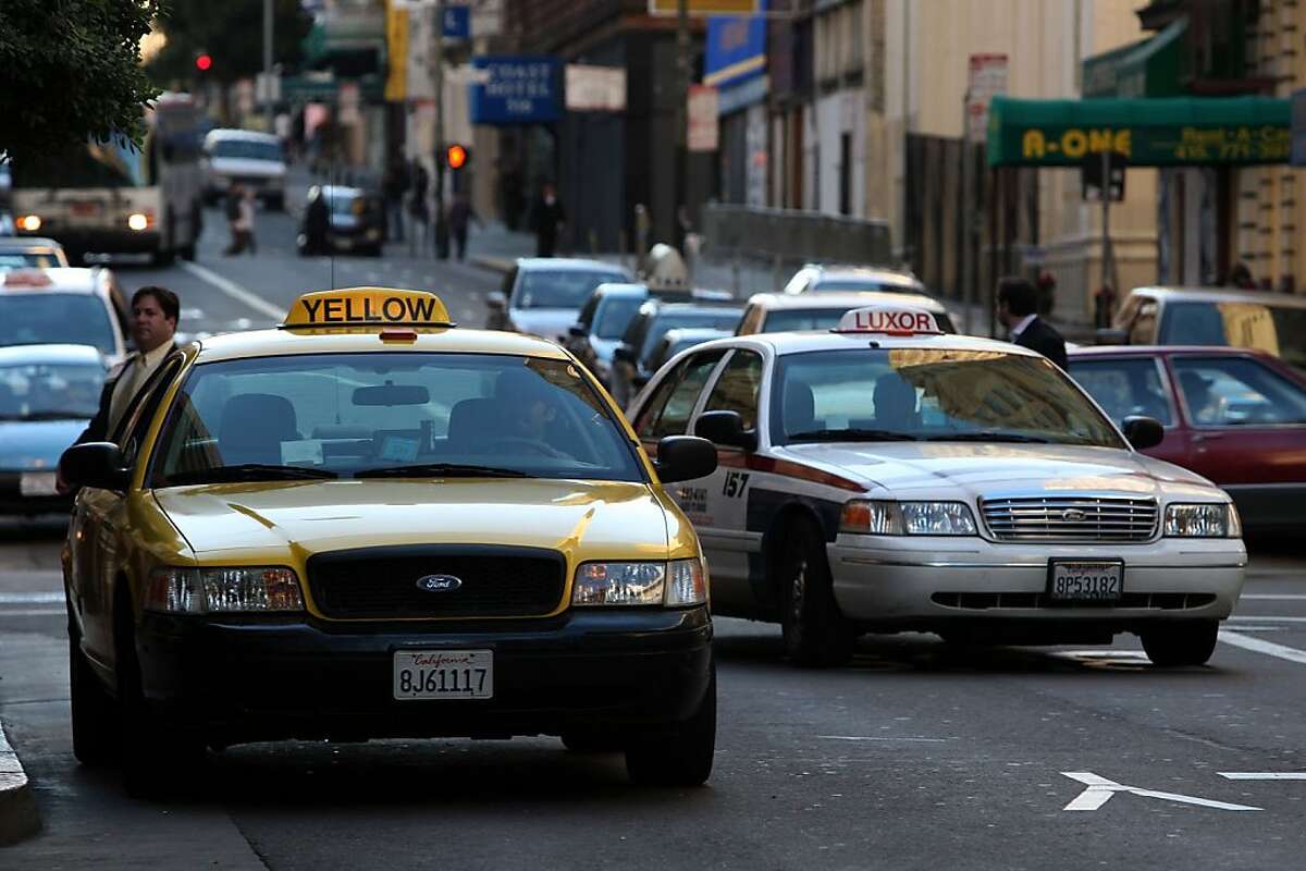 Taxi drivers in front of the Hilton Hotel San Francisco, Calif., on Monday, January 12, 2009. Gavin Newsom is proposing a plan to sell the city's coveted taxi permits to the highest bidders to raise money for the city .