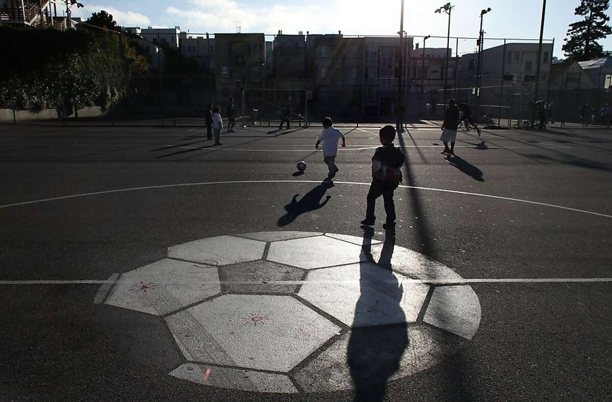 As part of park-wide renovations, the asphalt soccer field will be getting replaced with a state-of-the-art synthetic turf field at Mission playground in San Francisco, Calif., as soccer players in the neighborhood use the field on Thursday, May 11, 2011.