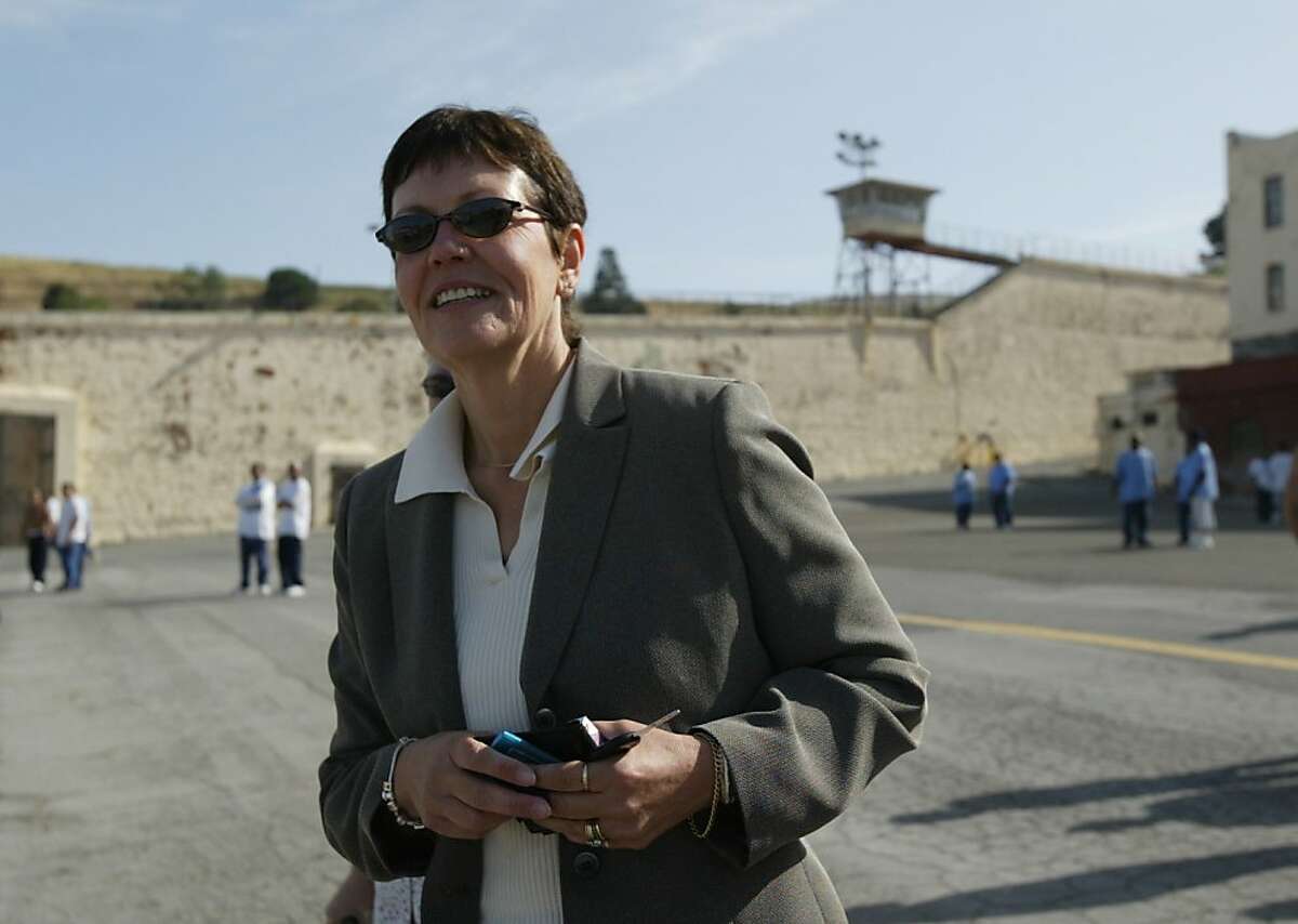 California Department of Corrections director Jeanne Woodford walks through the Yard at San Quentin Prison, Saturday May 1, 2004. She was the warden for 25 years and this is her first visits since leaving Feb 23, 2004, when she moved up the Sacramento to help clean-up the CDC budget problems.
