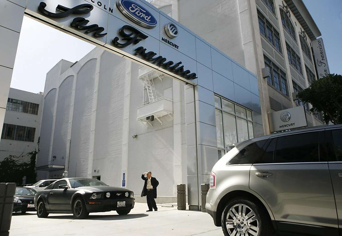 Security guards leave San Francisco Ford in their cars after their shift is over. The dealership, which has been in business for quite some time, suddenly closed its doors on April 30, 2011.