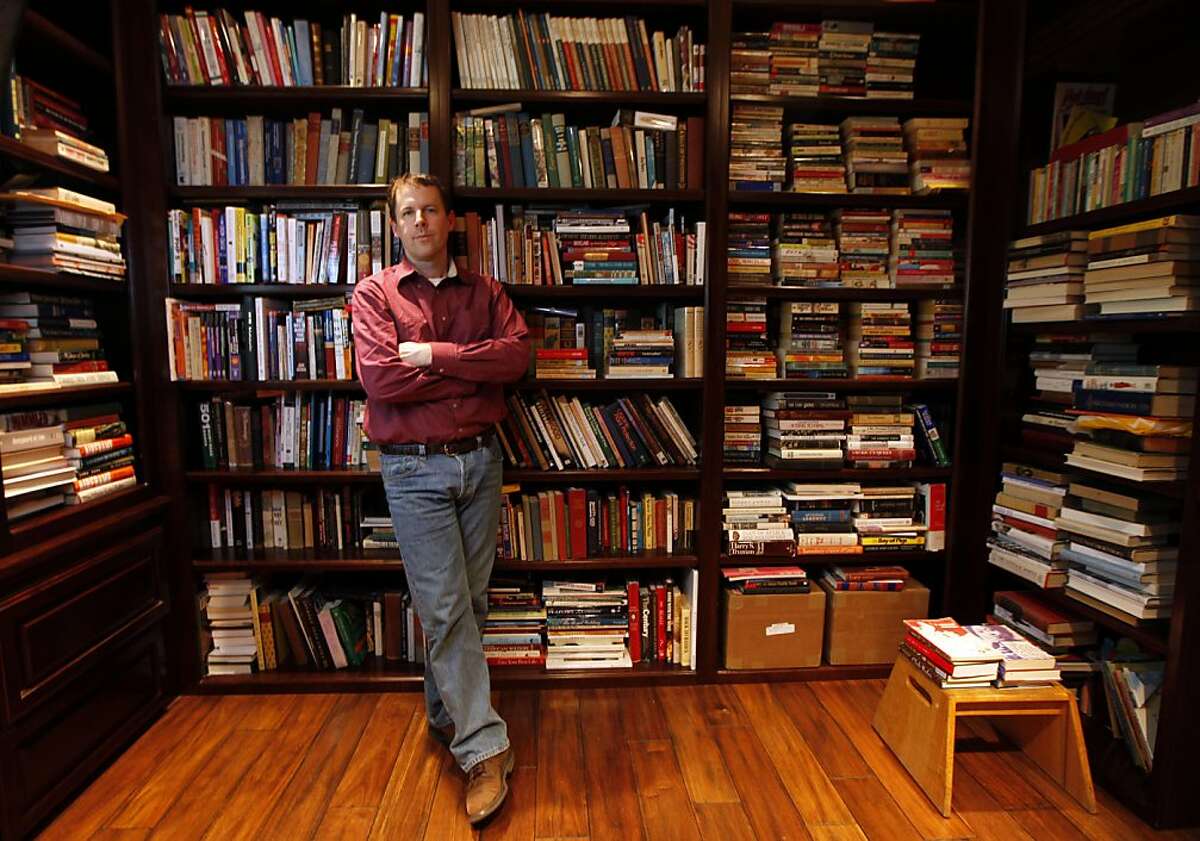 Mark Coker stands in his personal library on the Peninsula. Coker became frustrated when publishers wouldn't buy his novel, so he used his Silicon Valley startup background to create a tech company that would help other aspiring writers to turn their works into e-books. Today Smashwords is the leading site for people who want to self-publish anything from vampire novels to family histories, and has tens of thousands of e-books for sale on its own site and through other online retailers like Barnes & Noble. Wednesday May, 4, 2011