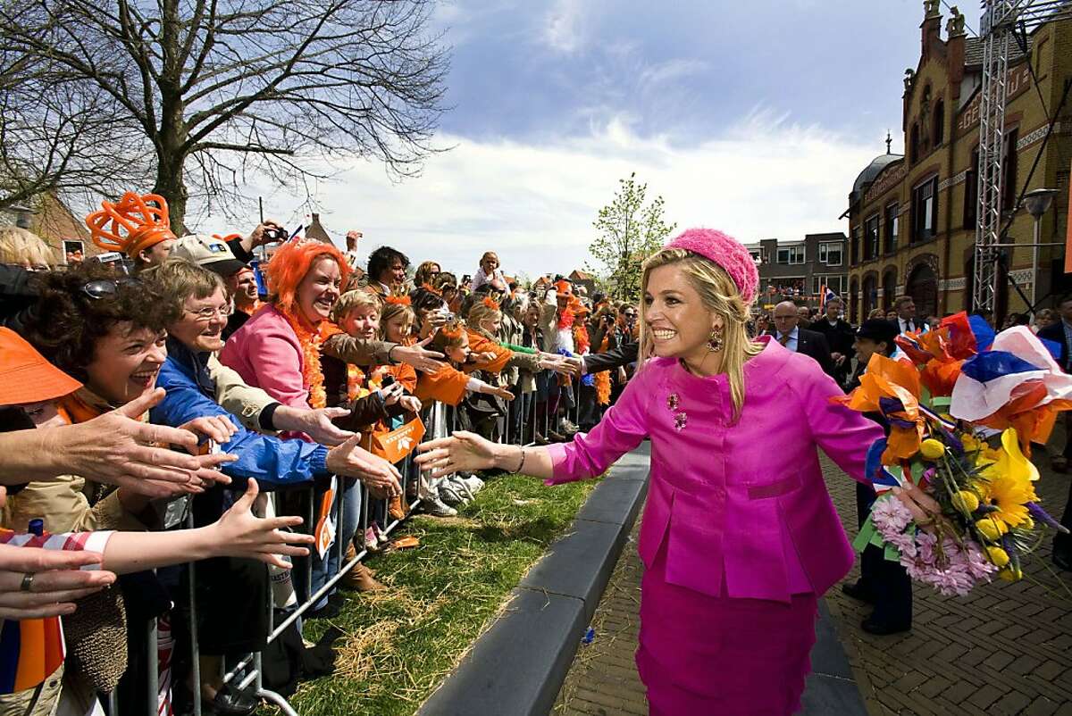In this April 30, 2008 file photo Netherlands' Crown Princess Maxima, right, greets well wishers during festivities marking Queen's Day in Franeker, northern Netherlands. As Kate Middleton settles into her new life as Princess Catherine, she need only look to Princess Maxima, wife of the heir to the Dutch throne, Crown Prince Willem-Alexander, for an example of how to make the tricky transition from commoner to royalty. Argentine-born Maxima is so popular in the Netherlands that an exhibition is opening on May 8, 2011 at the former royal palace Het Loo in the central city of Apeldoorn to mark her first 10 years in the country.