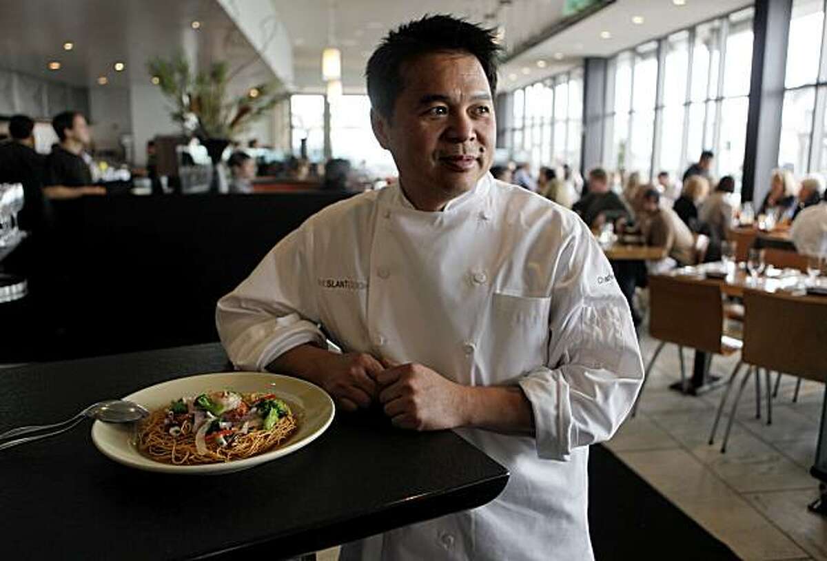 Charles Phan, on Tuesday January 26, 2010, is the founder and chef of The Slanted Door, in San Francisco, his restaurant is one of the most revered restaurants in the country. Phan a Vietnamese native left his country after the fall of Saigon coming to America with his family with nothing. The dish nearby is a Seafood with Crispy Egg Noodle.