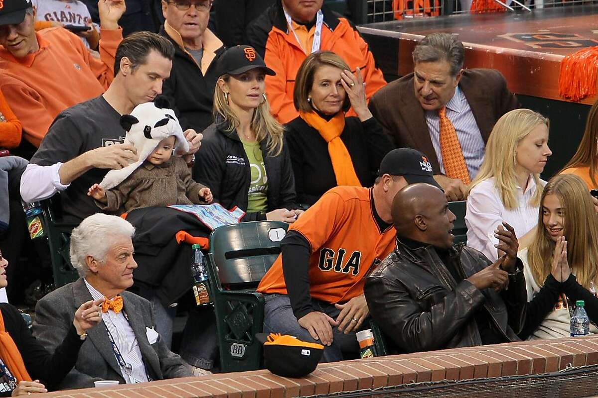 SAN FRANCISCO - OCTOBER 27: San Francisco Mayor Gavin Newsom sits with his wife Jennifer Siebel, daughter Montana and U.S. Speaker of the House Rep. Nancy Pelosi (D-CA) during Game One of the 2010 MLB World Series at AT&T Park on October 27, 2010 in San Francisco, California.