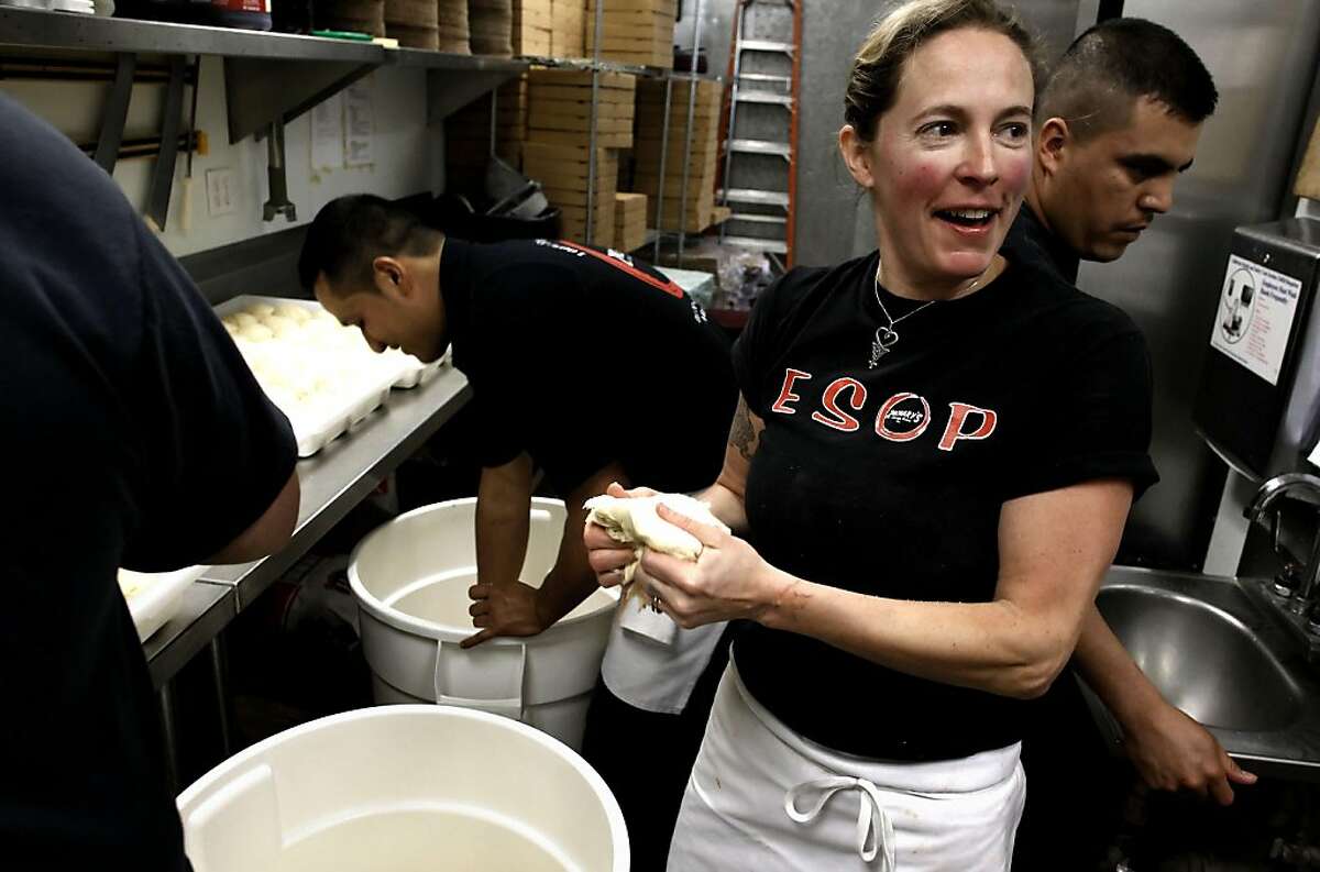 Traci Joyce, working the pizza dough before the lunch rush at Zachary's Chicago Pizza in San Ramon, Ca., on Thursday April 28, 2011. Joyce is one of 8,500 former California Culinary Academy students who is eligible for a rebate from a law suit settlement. Former students alleged the the San Francisco cooking school made bad promises about potential job placement after graduation. Joyce incurred $130,000 in student debt.